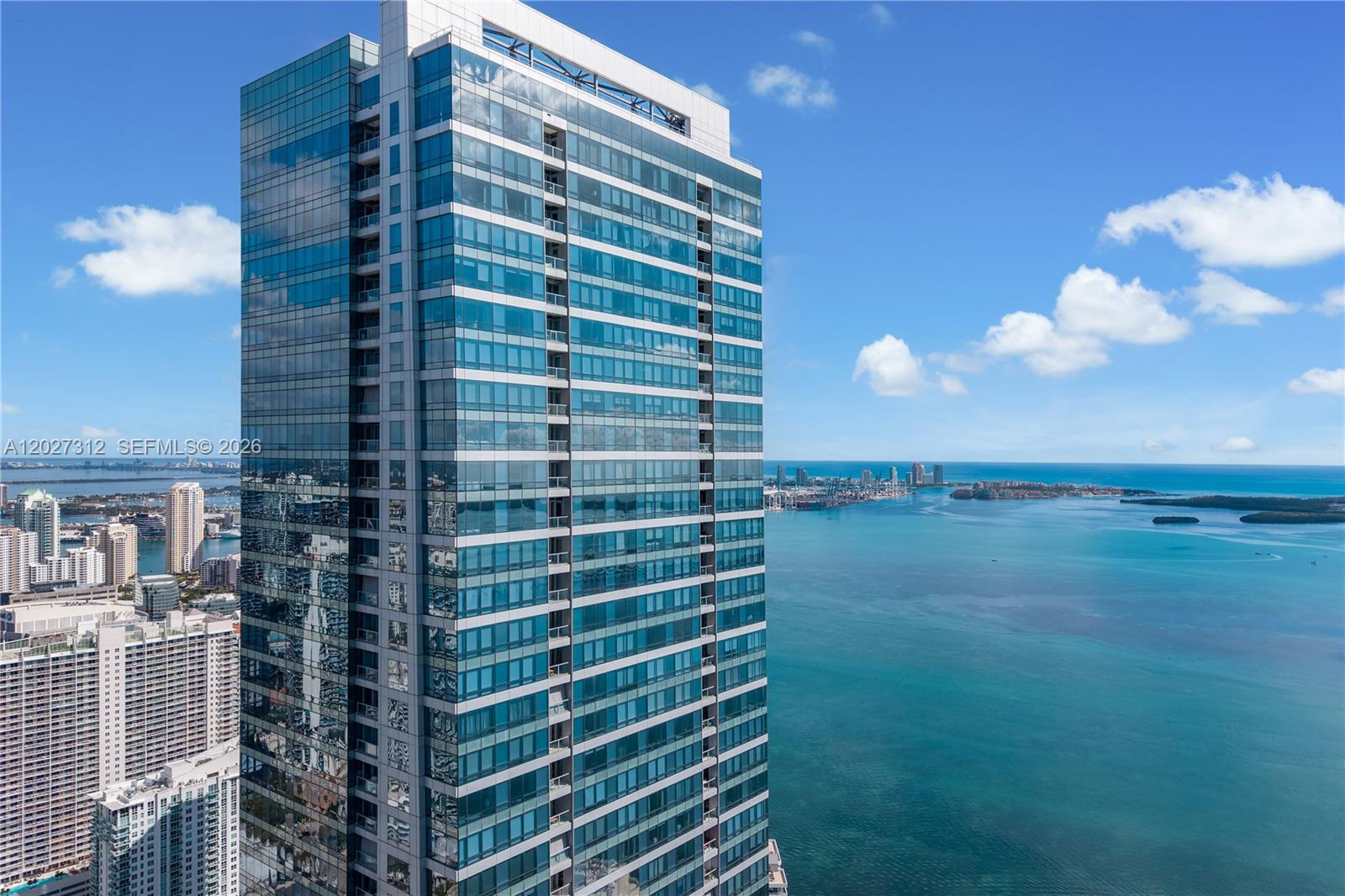 Welcome to a masterfully renovated residence in the iconic Four Seasons Residences, where luxury meets meticulous craftsmanship. This stunning two-bedroom, two-bathroom home spans 1,579 square feet of thoughtfully redesigned living space featuring sweeping ocean and bay views that never get old. Every detail whispers sophistication — from Arabescato Vagli marble imported from Italy to engineered oak flooring, integrated Sonos speakers, and sleek electric blinds throughout. The kitchen is a culinary dream with professional-grade ventilation and an industrial hood built for serious cooking. Both bathrooms have been beautifully updated, the primary bath elevated by a private, updated sauna for a true spa-like retreat. Residents also have the convenience of in-room dining from the on property restaurants. Nestled in the heart of Brickell, you're steps from Brickell City Centre, world-class dining at LPM and Cipriani, and the charming island of Brickell Key. Enjoy full Four Seasons services including valet, concierge, spa, multiple pools, salon, and two memberships to the onsite state of the art Equinox gym. This is Four Seasons living at its finest.