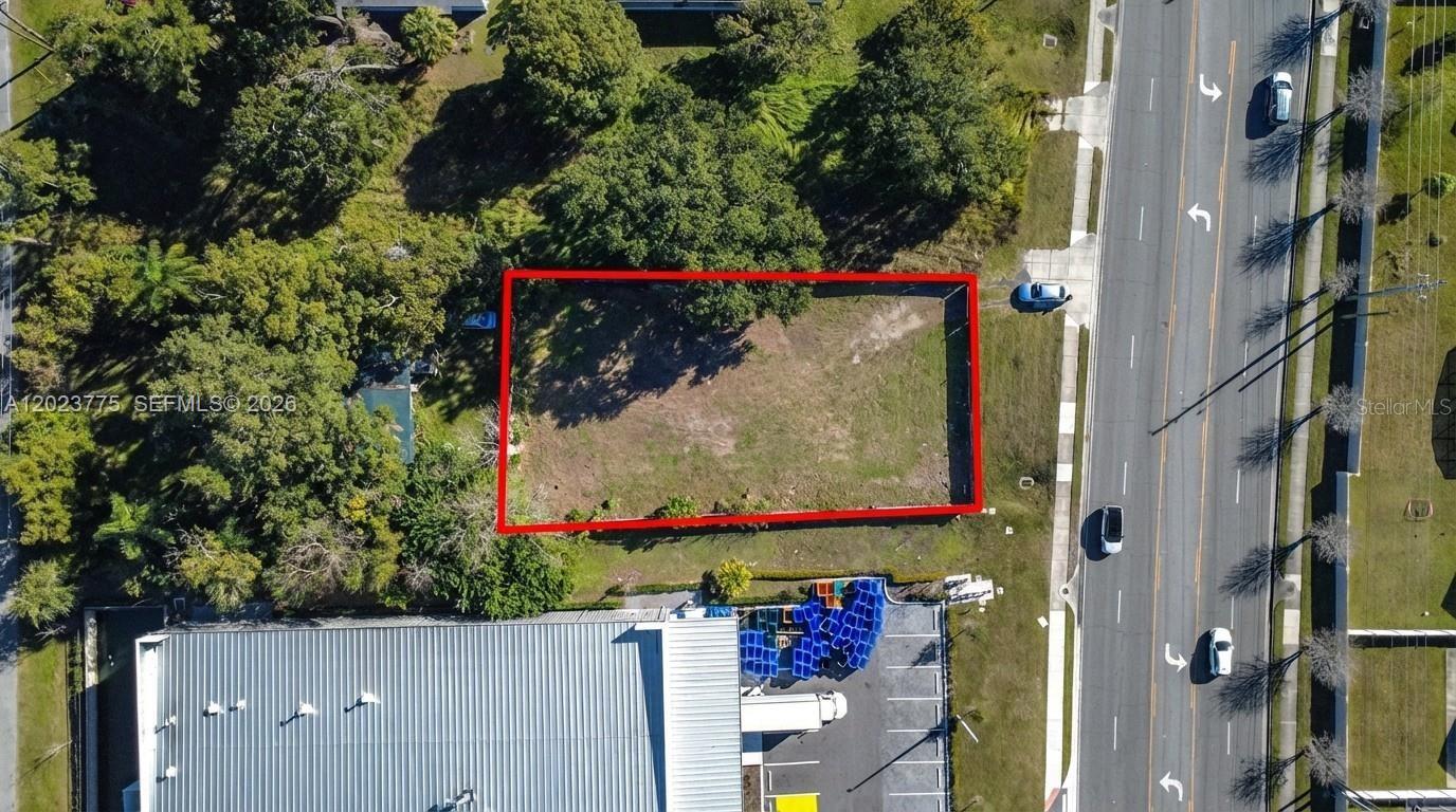 AMAZING OPPORTUNITY IN ORLANDO WITH HIGH VISIBILITY ON A HIGHLY TRAVELED ROAD. SELLER MOTIVATED! Welcome to this exceptional 0.24-acre vacant lot zoned COMMERCIAL, offering unmatched convenience with easy access to major highways and close proximity to Orlando’s premier destinations: just 5.4 miles to the Mall at Millenia, 6.7 miles to Universal Studios, 5.9 miles to Downtown Orlando, 8.1 miles to Orlando International Airport (MCO), 8 miles to International Drive, and 9.6 miles to Disney. Lightly wooded and development-ready, the property is surrounded by established homes and thriving businesses, making it ideal for ventures such as a warehouse, hotel, apartment studios, storage facility, office space, medical or dental clinic, barber/beauty shop, bakery, restaurant/café, clothing store, drugstore, or food and beverage market. This prime location presents a rare opportunity to bring your vision to life.