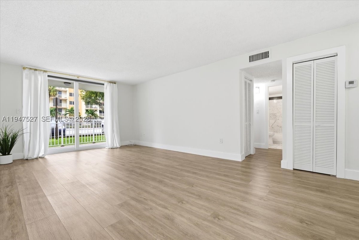 Beautiful, cozy 2-bedroom, 1-bath unit, freshly painted and remodeled. Features include impact sliding doors and windows, spacious bedrooms with large closets, and a cozy layout. Tankless water heater. Convenient first-floor location near the laundry room and mailbox. Excellent location close to shopping centers, restaurants, and major highways. Move-in ready!