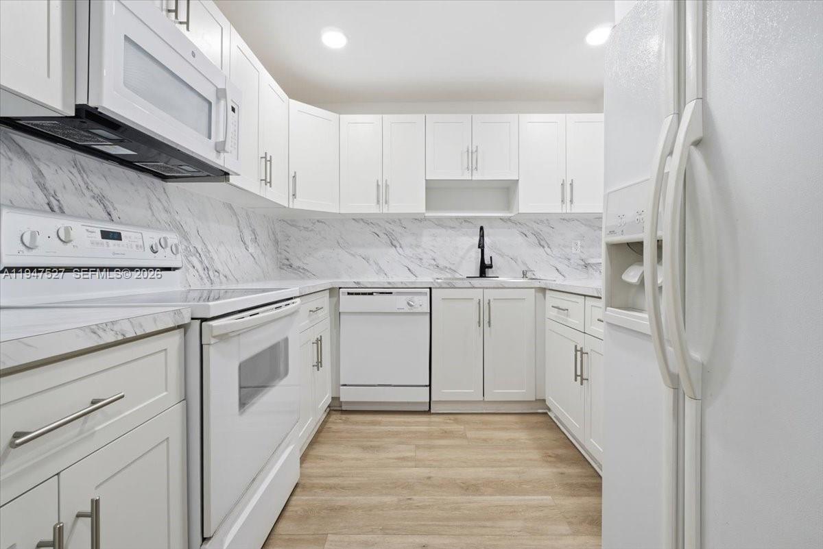 Beautiful, cozy 2-bedroom, 1-bath unit, freshly painted and remodeled. Features include impact sliding door and windows, spacious bedrooms with large closets, and a cozy layout. Convenient first-floor location near the laundry room and mailbox. Excellent location close to shopping centers, restaurants, and major highways. Move-in ready!