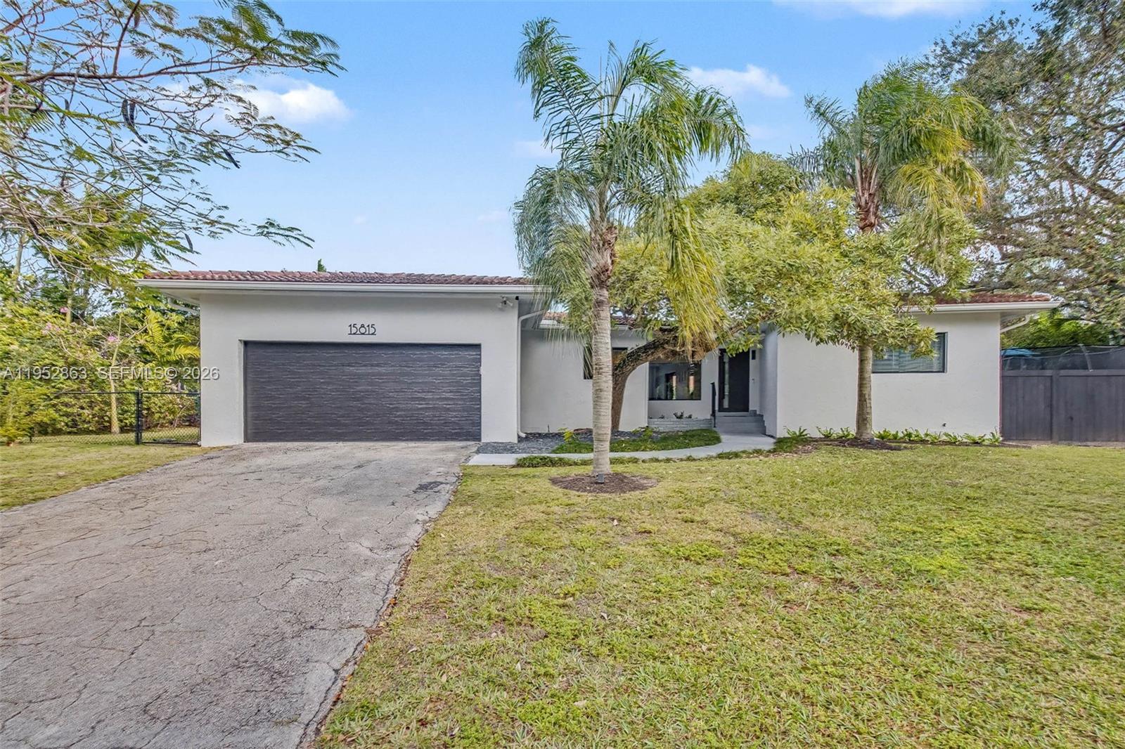 Fantastic Palmetto Bay home with 3 bedrooms/ 2 baths and many updates. Formal living room. Modern kitchen with counter seating, plenty of cabinetry Dining area. Impact windows/ doors. Indoor laundry room. Office off family room. Primary suite features walk in closet. Great fenced outdoor space with covered patio, wood deck, above ground pool, shed, playground. 2 car garage. Wonderful neighborhood. Close to A+ schools, Coral Reef Park.