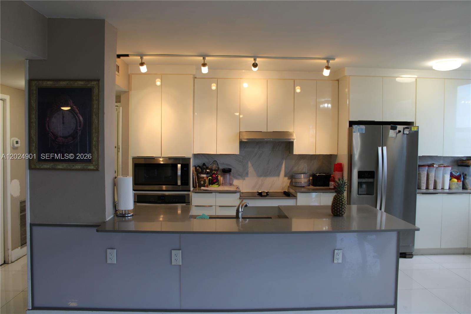 Come view this spacious 2 bedroom 2 bathroom corner unit condo in the heart of Hillcrest.  This unit is ADA compliant and is designed with a spacious open floor plan with water views overlooking the city of Hollywood and the Hardrock Hotel guitar at night! Stainless steel appliances, impact windows throughout, washer and dryer located inside the unit, 3 ton Ac unit was installed in 2025, additional storage unit and laundry facilities are also located on the same floor as unit, as well as wide doorways and halls for wheelchair access. The condo is located just minutes from Hollywood beach, Tri-rail and train station, FLL international  Airport, with nightlife entertainment, Young Circle, restaurants, heated pool, tennis courts and much more! This all ages condo unit is one you don't want to miss. Bring your buyers today!