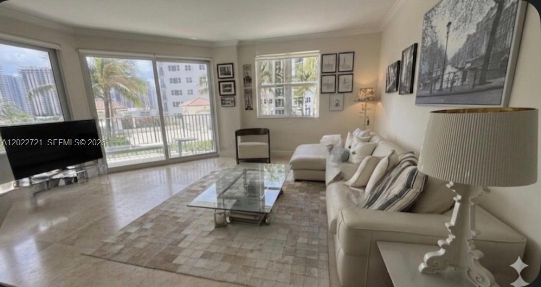 Turnkey 2BR/2BA residence at Turnberry Village offering approximately 1,312 SF of bright living space with floor-to-ceiling windows, granite countertops, stainless steel appliances, custom built-out closets, private balcony, and included storage. Ideally located along the Aventura Circle, just minutes from Aventura Mall, Sunny Isles Beach, fine dining, and the exclusive JW Marriott Miami Turnberry Resort & Spa. Residents enjoy resort-style amenities including pools, jacuzzi spa, state-of-the-art fitness center, racquetball court, clubhouse, children’s play area, BBQ area, valet, covered parking, and 24-hour security, plus direct access to scenic walking, jogging, and biking paths surrounding Turnberry Isles Golf Course. HOA includes water, internet, and cable.