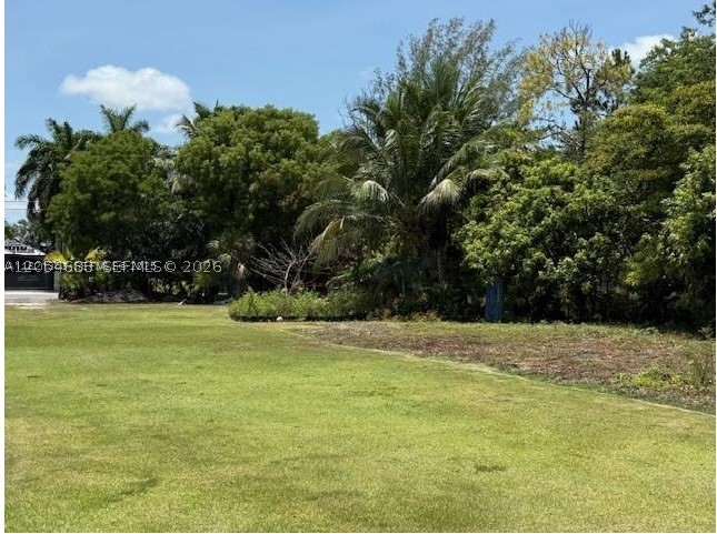 Rare opportunity to own a fully prepped 1.19-acre (51,836 sq. ft.) residential lot that's truly ready to build. The property has been elevated approximately 1 to 1.5 feet with more than 70 truckloads of fill, providing excellent drainage and minimizing flood concerns.

This cleared and fully fenced lot is equipped with key utilities already in place, including FPL electricity, a private well with pump, and plumbing installed throughout the property, saving the future owner significant time and expense. Perimeter light posts provide excellent illumination, while a beautifully tiled outdoor area offers additional functionality. A 40-foot storage container with electrical hookup is also included and may remain with the property.

Nature lovers will appreciate the abundance of more than 40 mature fruit trees, featuring mango, lychee, avocado, banana, coconut, star fruit, plum, soursop, and more, creating a private tropical oasis.

Whether you're looking to build your dream home or invest in a property with valuable infrastructure already in place, this exceptional lot offers endless possibilities. With utilities installed, extensive site preparation completed, and mature landscaping already established, it's a rare opportunity to begin building with confidence.