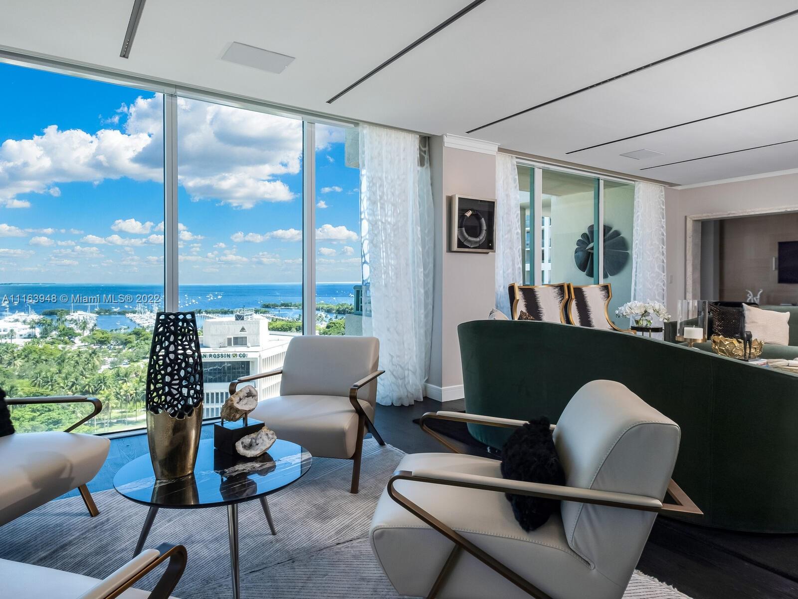 The ultimate in luxury and lifestyle at the Ritz-Carlton Coconut Grove. Featured in the LUXE Miami magazine. This one of kind residence is utterly remodeled into 2 primary bedroom suites with a simple 3rd bedroom conversion. Direct views over Sailboat Bay. Impeccably curated with the highest standards, filled with elegant designer interiors & lighting, top of the line finishes, remote operated window treatments, custom doors, spacious bathrooms w/automatic toilets. Wolf & Subzero appliances, wine cabinet, Dacor 4 bottle wine dispenser. Lufton lighting throughout. Complete Smart House. Ritz-Carlton hotel offers Isabelles restaurant, pool grill & the Commodore lounge. You will LOVE the neighborhood vibe & will receive a warm welcome as a new resident to the Ritz-Carlton.