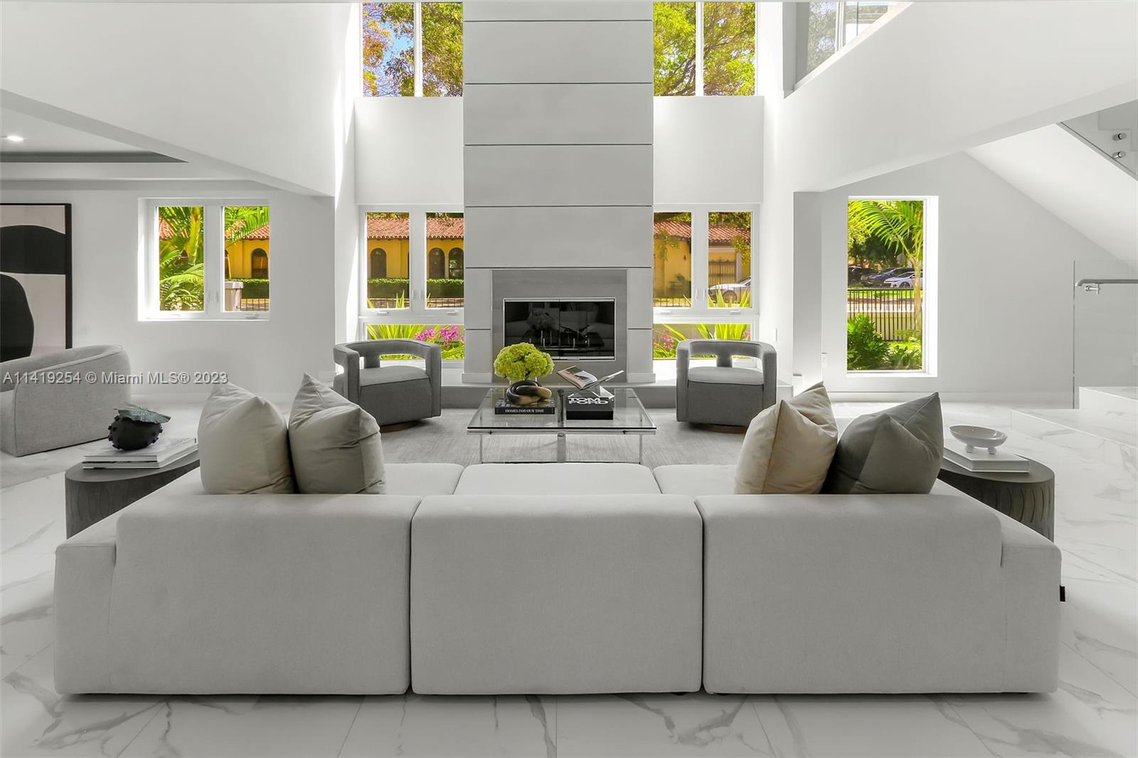 Nestled underneath a canopy of century old banyan trees, in the heart of Coral Gables, lies a spectacular 7 bedroom, 7.5 bathroom home, just steps from the Biltmore Hotel & Golf Course, Salvadore Park, 3 wonderful private schools and multiple tennis courts. The banyan trees create a perfect arch down the entire boulevard. The house features a new roof, new Wolf and Signature kitchen appliances, new wine cooler, new European kitchen cabinets with quartz countertops and porcelain backsplash, impact windows and doors, new marble pool deck, new custom built glass railings, imported floor tiles, custom closet cabinetry, gorgeous European style exterior lights and alarm system. Each bedroom has its own bathroom and the living room, formal dinning room and master bedroom are extremely spacious.