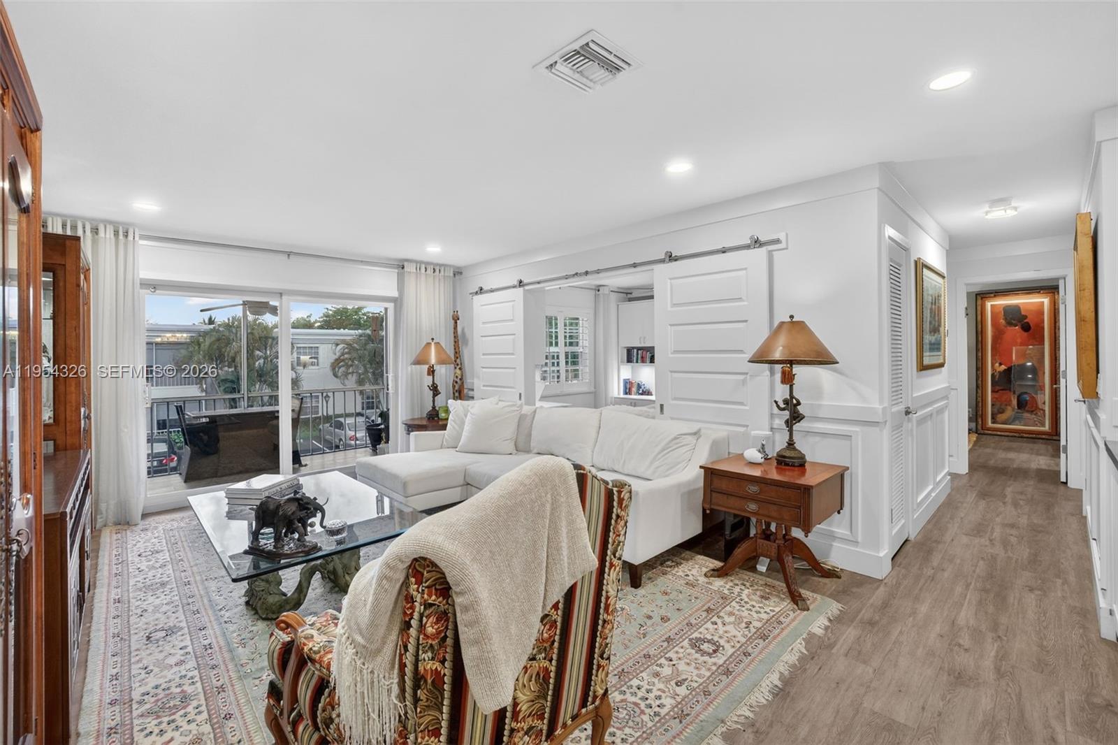 ONE OF A KIND TOP QUALITY PERMITTED WORK, BOATERS PARADISE ON 30+ ACRES W/ PATHS ON INTRACOASTAL! 2nd floor condo in WATERFRONT GUARD GATED Bay Colony Club w/ screened balcony. Fully remodeled modern w/ UPGRADED KITCHEN w/ updated cabinets, stainless appliances, oversized farmhouse stainless sink, under cabinet lights & stainless & porcelain backsplash. BEAUTIFUL BATHROOMS w/ new vanities, crown molding, new interior doors + barn door, wainscotting, 6" baseboards, new hardware, ceiling fans, LED LIGHTING & IMPACT WINDOWS & SLIDING DOOR for extra security. Full size WASHER & DRYER in unit & smart home WiFi enabled AC, lights & door lock. Guest bedroom w/ BUILT IN MURPHY BED & DESK. 2024-25 ROOF. 

Bay Colony Club has SECURE / MANNED 24 hour gate, deep water Intracoastal community w/ direct ocean access w/ NO FIXED BRIDGES, ideal for BOATING enthusiasts. DOCKAGE AVAILABLE for VESSELS UP TO 50 FT, when available. Slip rental separate from the unit & currently runs approx $2 per linear foot / month (rates set by the association & subject to change). Flexible monthly contracts ideal for seasonal/full time boaters.

Resort style waterfront living w/ 4 HEATED POOLS including 1 directly on the INTRACOASTAL, 6 TENNIS & PICKLEBALL courts, FITNESS CENTERS, multiple CLUBHOUSES, BBQ areas, bike storage, & beautifully maintained tropical grounds & BUTTERFLY GARDEN. Near Commercial Blvd, mins to beach, waterfront dining, shops & easy ocean access. CABLE INCLUDED. Furniture for sale.