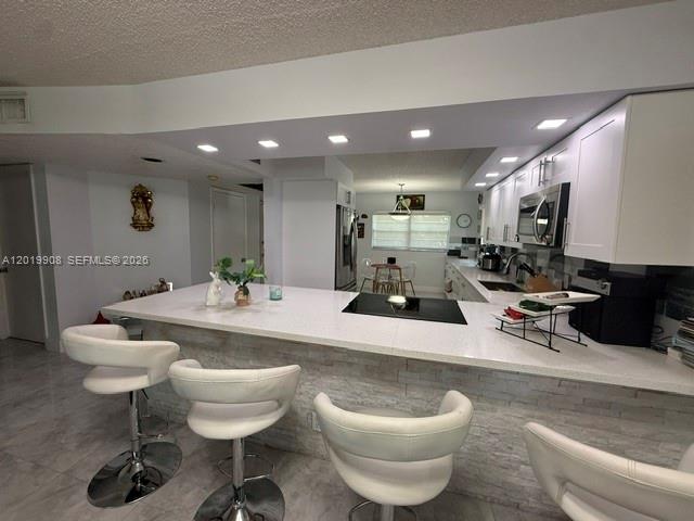 Beautifully remodeled 2 bedrooms, 2 baths corner unit offering 1507 sq. ft. of spacious living in the heart of Pembroke Pines. Located on the second floor of a well-maintained building with elevator access, this bright and airy residence features an open layout, generous living areas and tasteful modern upgrades throughout. The desirable corner location provided added privacy and abundant natural light. A rare opportunity to own a move-in ready home with comfort, style and convenience in one of Pembroke Pines's most sought after community Century Village. 55+ community. Anyone can purchase but the resident must be 55 or over.