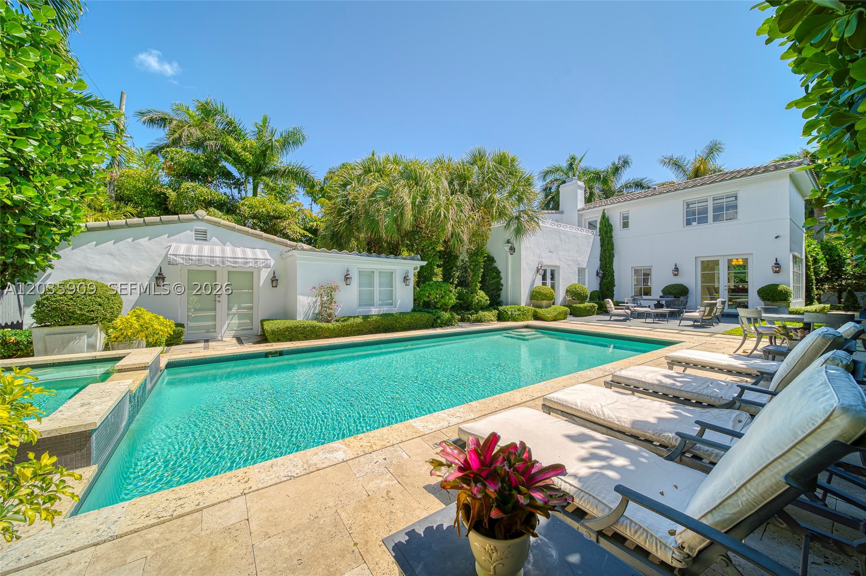 2534 Flamingo Drive offers a rare opportunity to own a classic architectural gem on coveted Flamingo Drive with beach access, nearly complete and ready for a buyer to bring their final vision to life. Offered as-is in its current stage, the residence includes a curated selection of premium materials and essential groundwork already in place, creating a refined foundation for a buyer to complete the final details to their own taste.
Set on an expansive lot with a gated circular driveway, this 4 bedroom, 4 bath residence features a poolside guesthouse with a separate bedroom, bath and kitchen, along with a large heated pool and spa surrounded by lush landscaping and soaring palm trees. Elevated materials include honed Roman Travertine, chevron oak hardwood flooring, designer lighting selections, and other thoughtfully considered finishes, offering the framework for a custom-tailored Miami Beach residence.
Perfectly positioned near a footbridge providing direct access to the water, as well as top hotels, shops, and restaurants, 2534 Flamingo Drive presents a singular opportunity to complete a one-of-a-kind home in one of Miami Beach’s most sought-after neighborhoods. Photos are from previous listing.