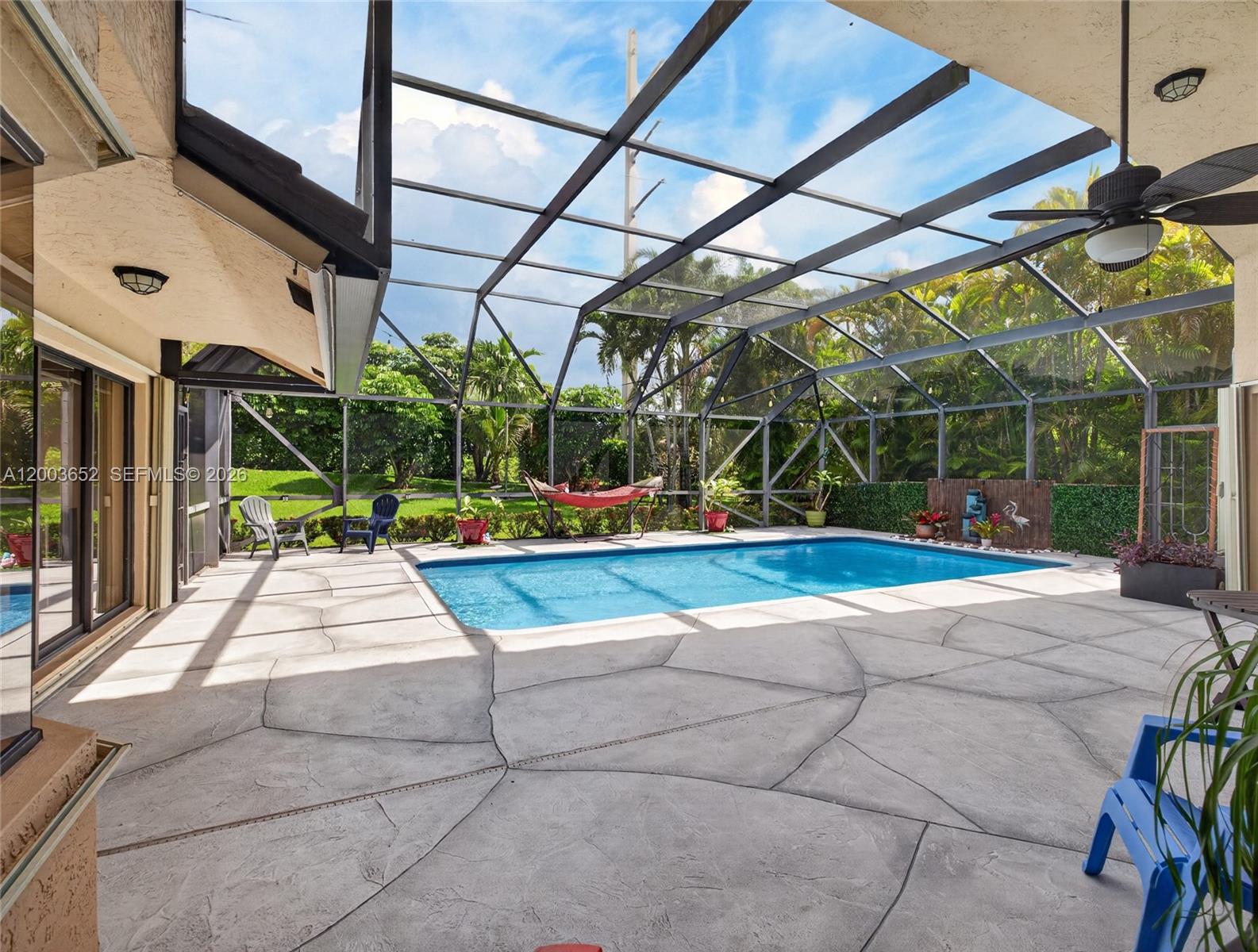 Rare single-story CBS construction — 3,394 sq ft. 4 bedrooms | 3 fully renovated bathrooms, Soaring vaulted ceilings throughout main living areas, Oversized heated pool with new heat & cold pump system,Exceptional private backyard on 13,050 SF lot — north-facing, Large-format polished porcelain tile throughout, Private den/office with French doors & built-in cabinetry, 2-car garage | HOA only $700/quarter, Country Isles — top-rated Weston school district