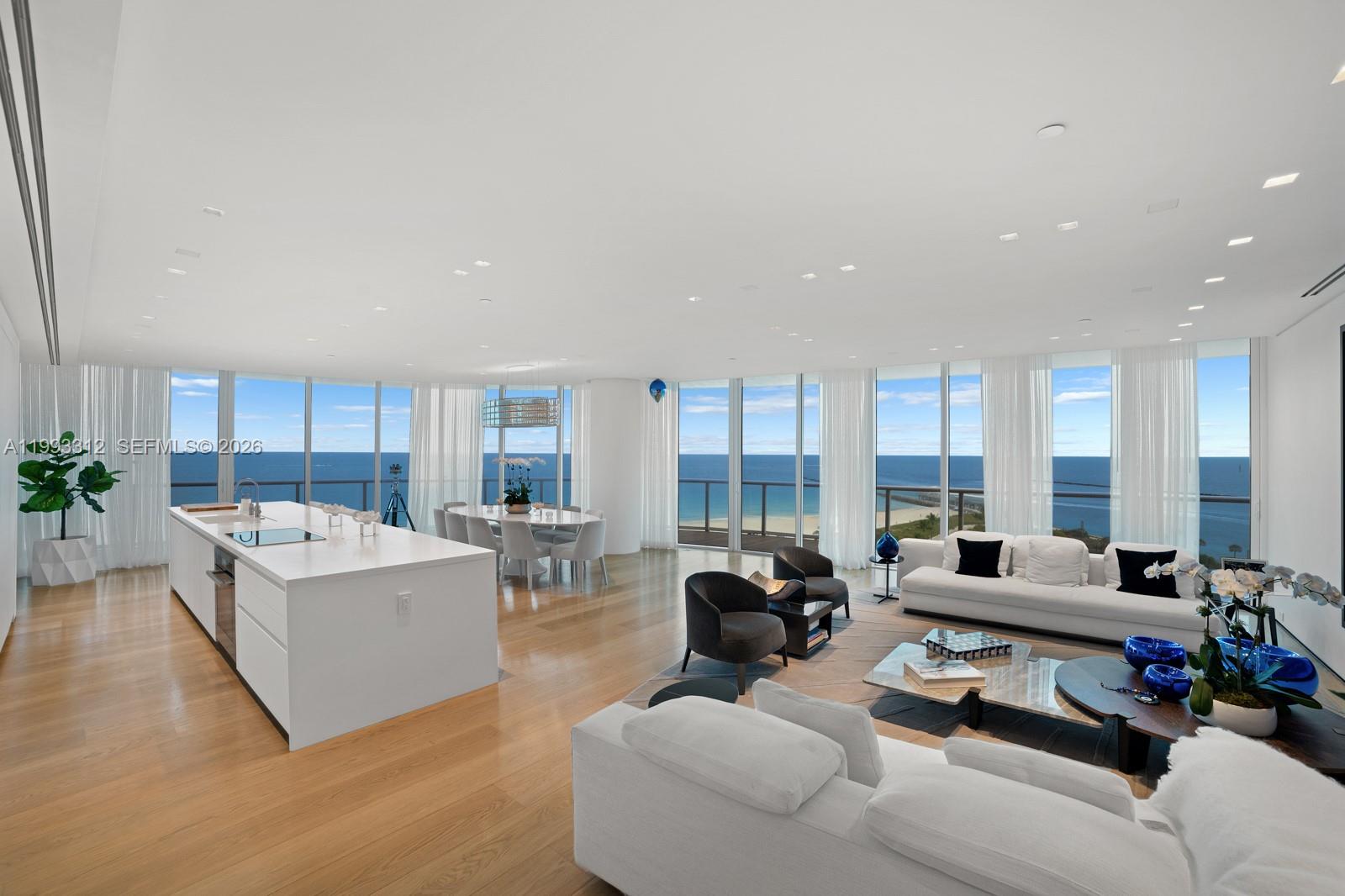 Welcome to an unparalleled living experience at 100 South Pointe Drive, Unit 1106/07, Miami Beach, FL. This exquisite residence offers a harmonious blend of luxury and modern sophistication, enveloped within 4,378 square feet of thoughtfully designed space.
Upon entering, a private elevator ushers you into an expansive living area, where floor-to-ceiling windows frame breathtaking views of the ocean and city skyline. The open-concept layout seamlessly connects the living, dining, and custom Boffi kitchen, creating an ideal setting for both relaxation and entertaining. The gourmet kitchen is a chef's delight, featuring premium appliances and sleek finishes.
The residence boasts five generously-sized bedrooms ensuring privacy and comfort for all. The primary suite is a sanctuary of luxury, offering a spacious retreat with a spa-like bathroom and ample closet space.
Residents enjoy a suite of world-class amenities, including a heated pool, state-of-the-art gym, and spa facilities for rejuvenation. Outdoor enthusiasts will appreciate the three clay tennis courts and bike room, while the common media and recreation room provides a perfect venue for gatherings. Additional conveniences include a doorman, concierge services, valet parking, and assigned garage spaces.
Experience the epitome of high-rise living in this exclusive Miami Beach address, where elegance meets unparalleled convenience. Your luxurious coastal lifestyle awaits.