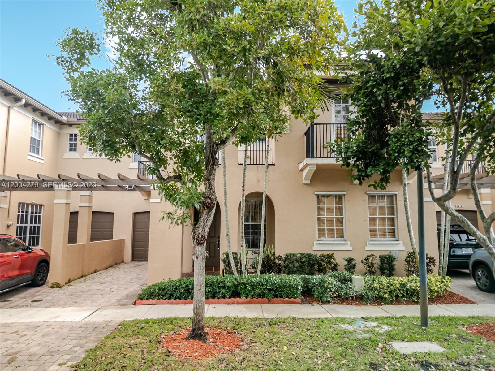 Beautiful 3-bedroom, 2.5-bath townhome located in the Cimarron community of Davie, offering a 1-car garage plus an additional carport.  Conveniently located near Nova Southeastern University, Florida Atlantic University, and Broward College. The home features vinyl flooring throughout that is anti-scratch, waterproof, and pet resistant. The primary suite includes two walk-in closets and an en-suite bathroom with dual vanities, a soaking tub, and a separate walk-in shower. Each bedroom has access to its own private balcony.