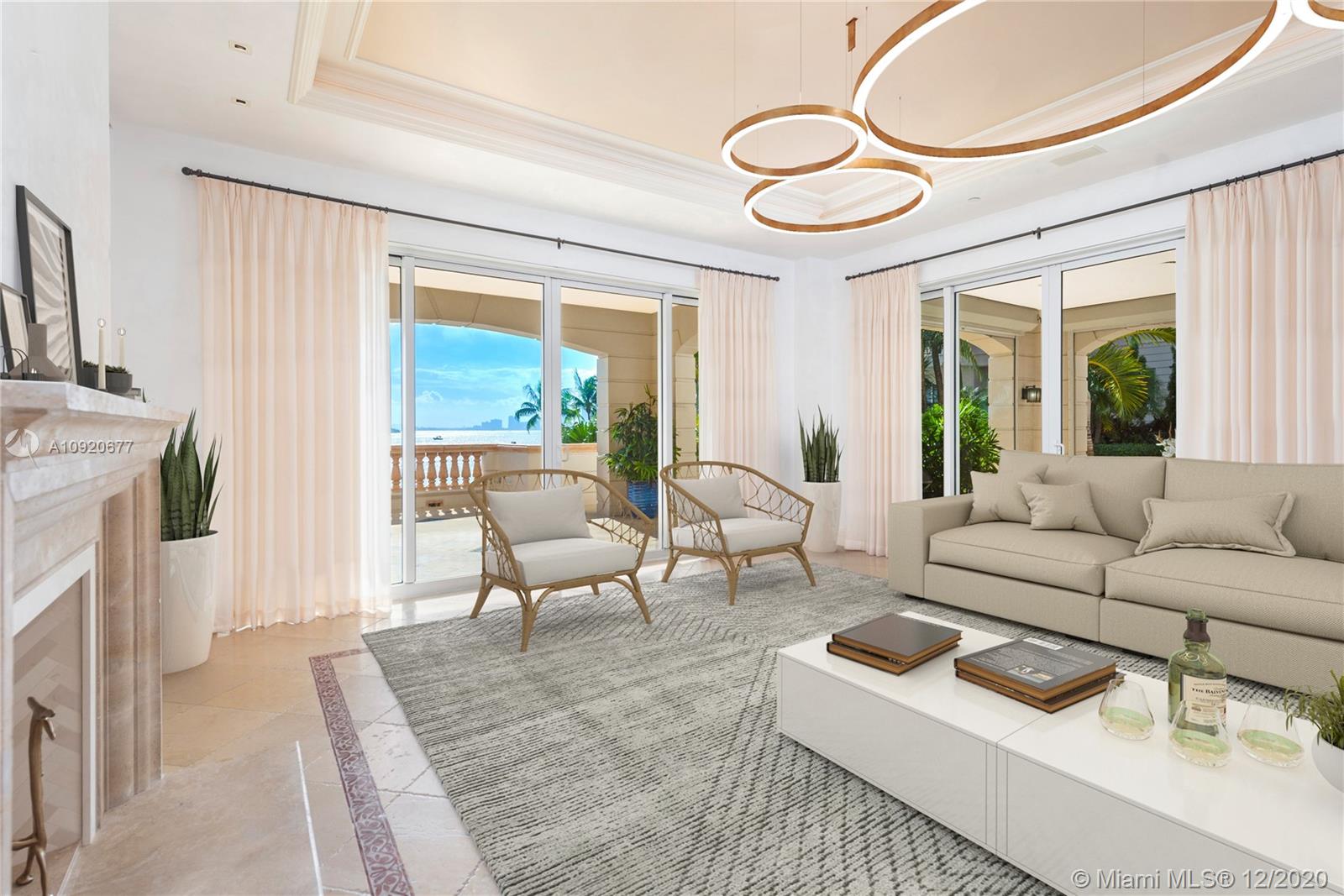 Experience Fisher Island at it's finest in this stunning ground floor Bayview residence! This one of a kind gem greets with you with 4 bedrooms, 4.5 baths, high ceilings, expansive wrap around terraces overlooking the Miami downtown skyline, Biscayne Bay and Virginia Key. The unit has been renovated. Features include: marble floors throughout, top of the line kitchen and bathrooms, smart house, walk in closets, Venetian stucco, automated window treatments, etc. Live the Fisher Island lifestyle in this exceptional offering! Photos with furniture have been virtually staged. Easy to show!