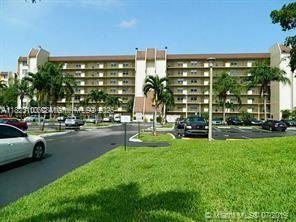 2/2 corner unit , apartment with beautiful view of the lake and golf course , close to Nova University tile and laminate floors , nice kitchen cabinets , good for investors , baths need remodeling, Hurricane Shutters,  first floor , easy access to parking spot . ok to lease first year , pets allowed.