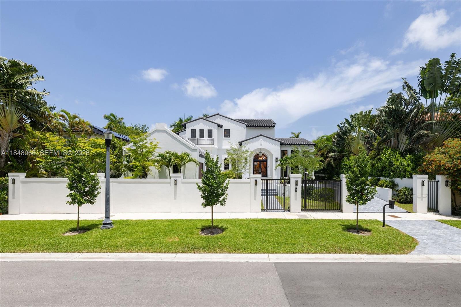 Brand new custom-built single family 4,823 sf home (per architectural plans) on rare 10,900+ sf lot located in prime North Bay Road.
This architectural gem boasts cathedral and tray ceilings, a dramatic white marble staircase, and is fully furnished with high end interiors and custom lighting.
The home features 3–4 bedrooms, including a lavish primary suite with balcony, sitting area, luxurious bathroom, and walk-in closets.
The chef’s kitchen includes a bar area, high-end appliances, and bespoke finishes. Other features include: Outdoor kitchen hook up ready for customization, integrated sound, lighting, and speaker systems controlled by a smart system, gated property for privacy and security, and two-car air-conditioned garage. Just steps to Sunset Harbour’s shops and restaurants.