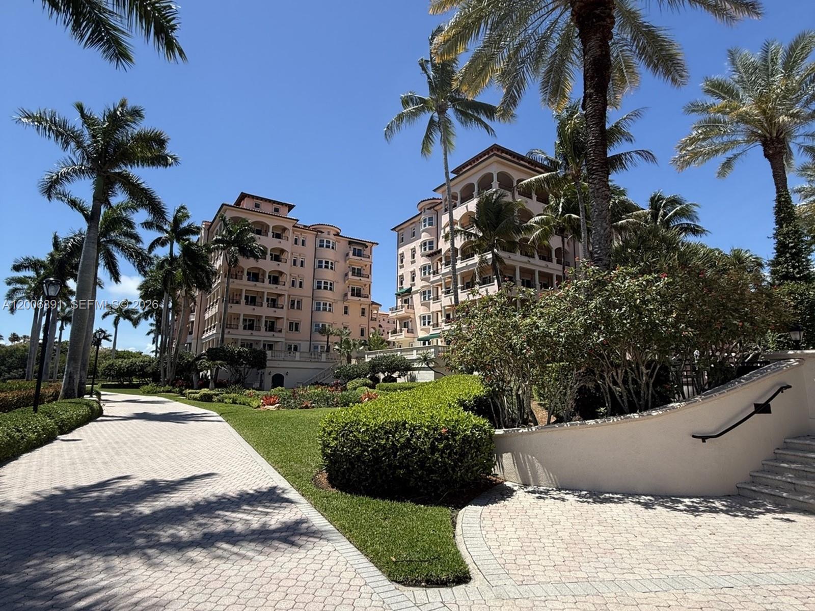 Exceptional corner residence in the Venice at Deering Bay Yacht & Country Club with a 180° wraparound terrace showcasing marina, bay, pool, and lush landscape views. 3 bedroom 2.5 baths split plan. This light-filled home features impact windows, plantation shutters, porcelain & wood floors, granite kitchen with Thermador double wall oven, marble baths, walk-in closets, pantry & laundry room. Recent upgrades include wood floors, 2 Trane A/C units, custom built-ins, new washer/dryer/dishwasher & shower doors. Only 2 units per floor. Includes 2 parking spaces, golf cart space 32 & large storage #5. Gated community with pool & 24-hr security. Membership DBYCC separately. Priced to sell!