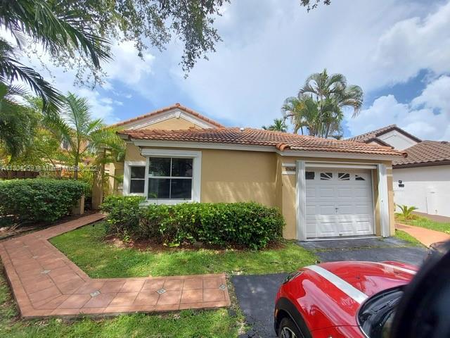One story 3 Bedrooms, 2 Bathrooms, located in gated community. Tile throughout with wood laminate in bedrooms, update bathrooms, large backyard, with nice covered terrace. 
Wood Cabinet w/ granite counter top, stainless steel appliances, painted in white, with the neutral color in bathrooms. quite neighborhood, centrally located, close to Turnpike and walking distance to shopping center.
EASY TO SHOW !!!