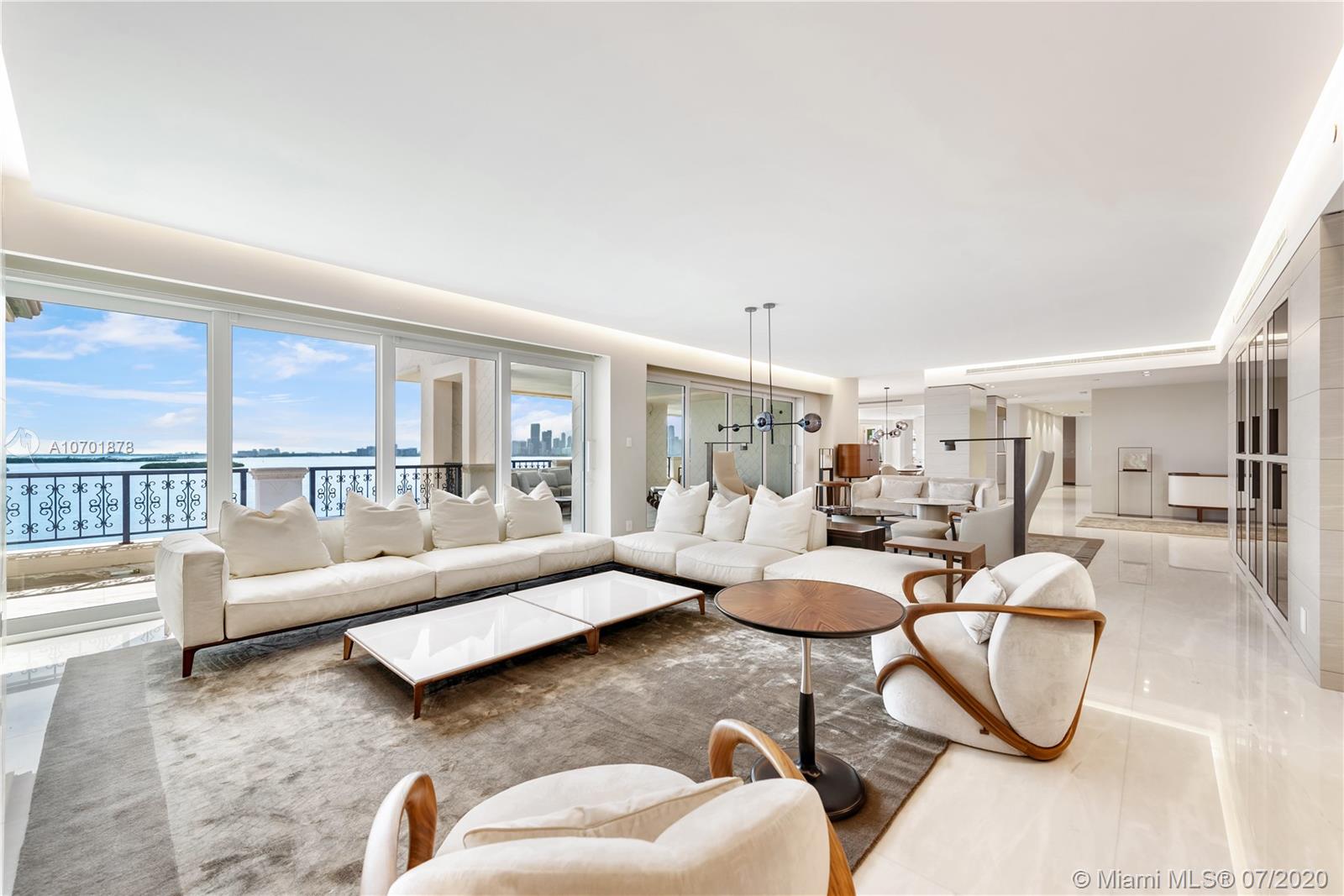 Complete spectacular renovation finished the end of 2019. This beautiful Bayview lower PH is the first unit in the US to be totally designed & furnished A-Z by Giorgetti. 5BR/7+1BA and over 2,000 SF of terraces with Miami Beach and sunrise views plus unobstructed Bay and Downtown Miami Skyline sunset views. Boasts Italian marble & oak floors in all bedrooms, open flowing living/dining area and family media room. Gourmet kitchen with top of the line Miele appliances, center island & 4 wine chillers. Bay-facing principal suite with a large office & separate dual principal baths with Turkish sauna, glass & onyx shower and voluminous walk-in closet. Smart home with new WinDoor motorized sliding doors & full replacement of A/C & electric systems.