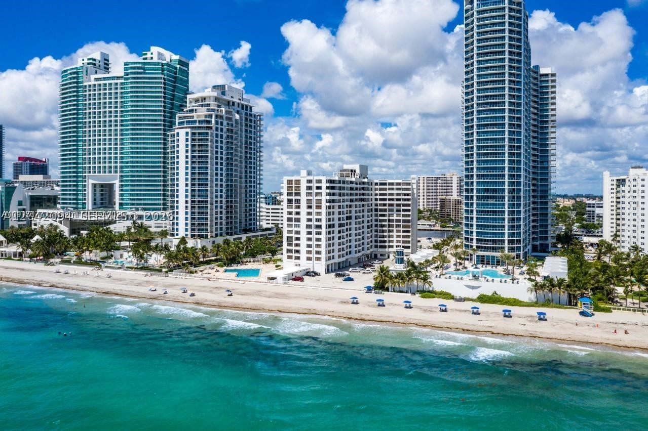 SPECIAL SUMMER PRICE -ABSOLUTELY STUNING -WHITE AND CRISPY - GORGEOUS AND COMPLETELY RENOVATED 2/2 CONDO IN THE HEART OF HOLLYWOOD BEACH WITH THE MOST SPECTACULAR DIRECT OCEAN VIEWS,NEW IMPACT WINDOWS AND NEW BALCONY ! ! OPEN KITCHEN ,HUGE WINDOWS, WHITE PORCELAIN FLOORS THRUOUT, WASHER & DRYER INSIDE ,INDESCRIBABLE ENERGY! PRIME LOCATION CLOSE TO FAMOUS BOARDWALK, DIRECT OCEAN ACCESS ,PHENOMENAL POOL, BARBEQUE AREA ,GYM,24/7 SECURITY AND VALET THIS UNIT HAS ASSIGNED PARKING SPOT WHICH IS VERY RARE HERE THIS IS YOUR OPPORTUNITY! LIVE IN PARADISE. BALCONY IS OPEN,WASHER AND DRYER INSIDE! CONDO SHOWS LIKE A MODEL