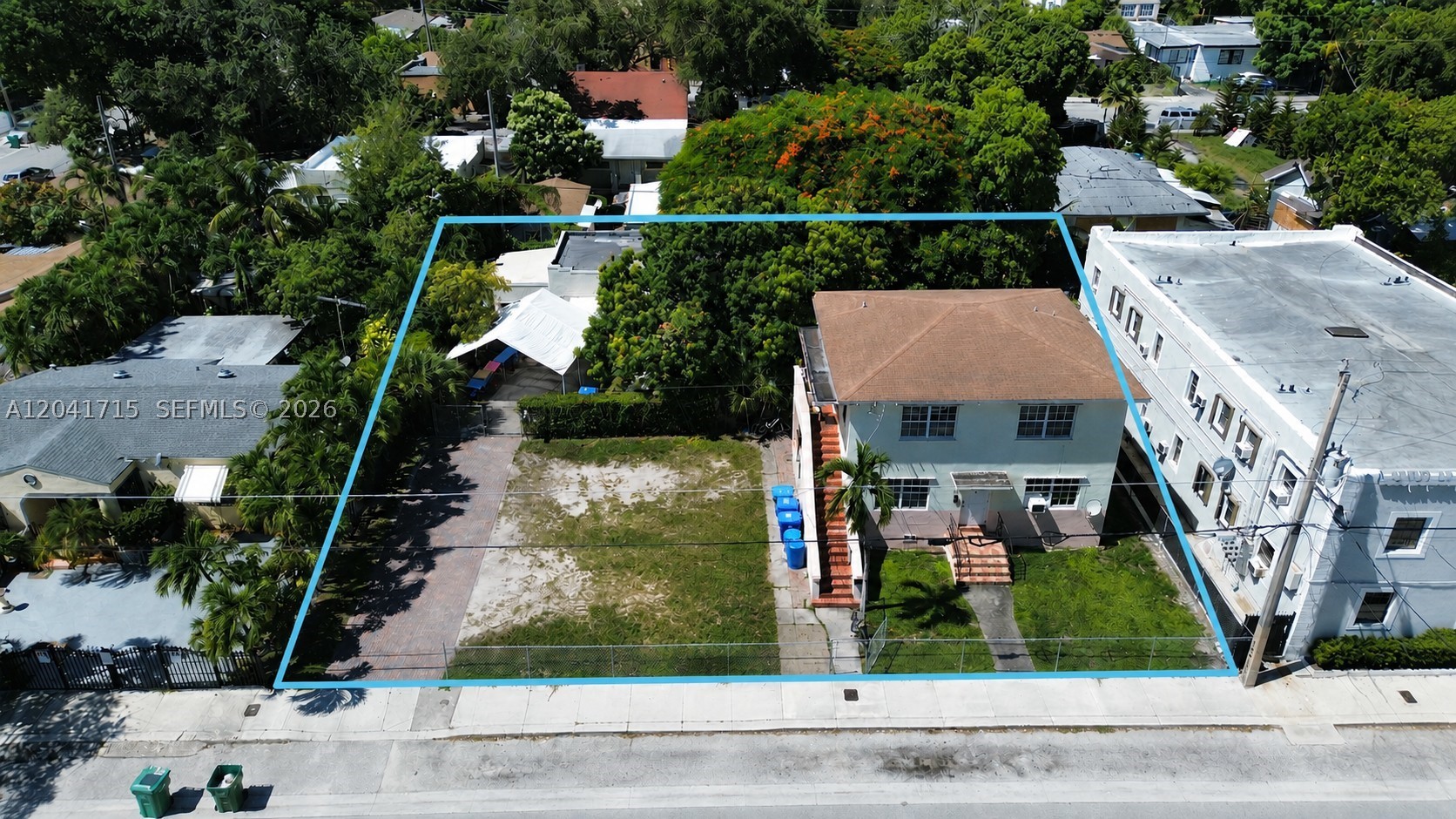Rare opportunity in the heart of Wynwood Norte, one of Miami's fastest-growing urban neighborhoods. Situated on an approximately 10,000 SF double lot and zoned T4-R with the NRD-2 Overlay, the property offers significant redevelopment potential, with the possibility to develop up to 36 residential units. The property is currently consists of two existing structures, including a two-story duplex and a separate single-family residence, creating immediate income-producing opportunities while future development plans are pursued. Investors may choose to continue operating the existing improvements, renovate and reposition the property for increased rental income, occupy one of the residences while generating income from the remaining units, or assemble neighboring parcels to create a larger-scale development opportunity. Located just minutes from Wynwood, Midtown Miami, the Design District, and major transportation corridors including I-95 and I-195, the property benefits from strong demand drivers, walkability, and continued public and private investment throughout the area. Whether acquired as a long-term land bank, an income-producing covered land play, a value-add renovation project, or a future multifamily development site, 255 NW 32nd Street offers investors and developers multiple paths to create value in one of Miami's most dynamic growth corridors.