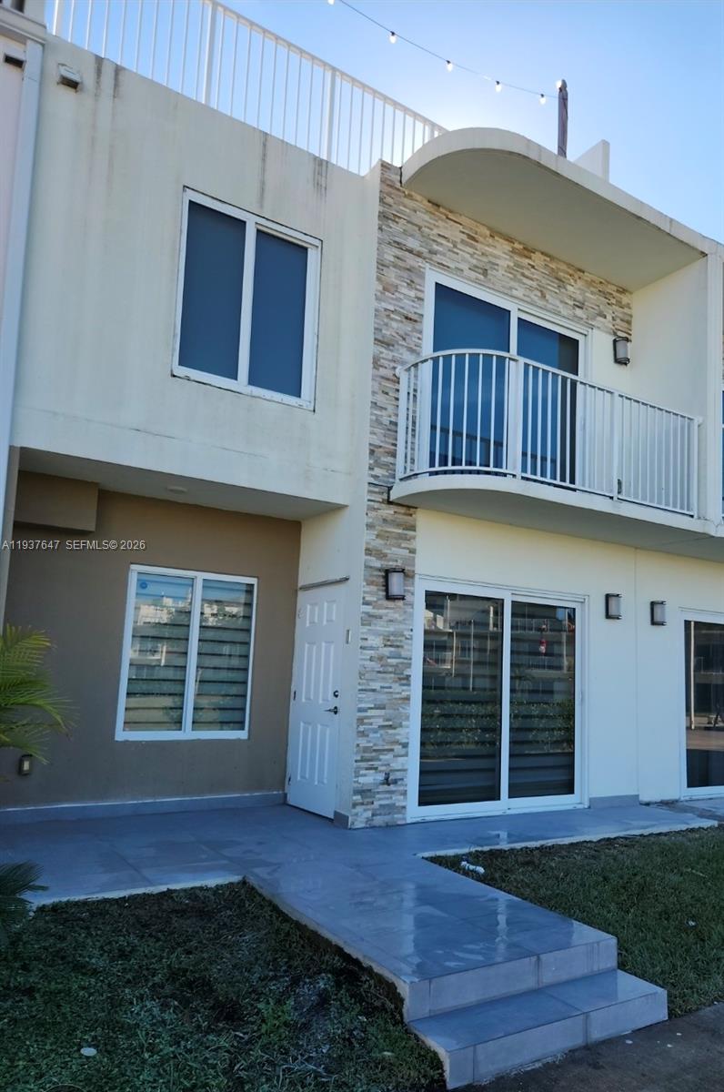 Well-maintained 4-bedroom, 3.5-bath townhouse built in 2021, offering a functional layout and modern finishes throughout. Features include impact windows and doors, ceramic and laminate flooring, and bright, open living spaces. The ground-level suite provides flexibility for guests or extended family. Enjoy a private rooftop terrace and low HOA. Easy to show. Seller motivated.