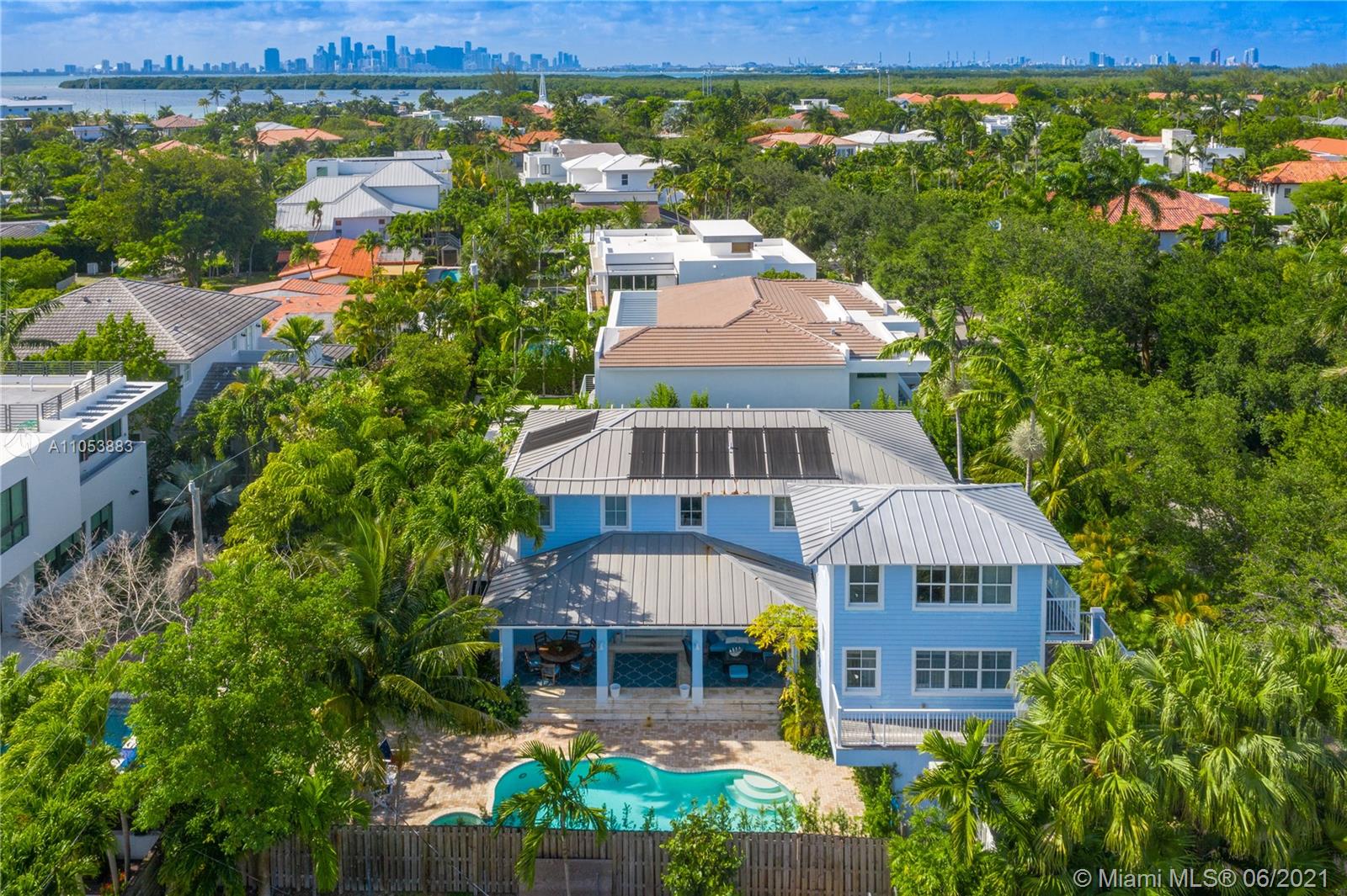 Magnificent and move-in ready home on Woodcrest Road with top of the line finishes and tons of natural light.  This residence is chic, elegant but yet cozy and very private. Offering 5 bedrooms plus staff room, 6.5 bathrooms with lush landscaping all throughout and an incredible terrace, patio and pool area where you can enjoy the south Florida sunshine. This floor plan is very inviting with a gorgeous living, dining, kitchen and family room with an extra den that can be used as an office or library. The second floor has 3 bedrooms all in suite in the main house and the other 2 bedrooms are located above the carport which make them the perfect setting for a guest room and gym. The outside area is very ample and has an extra space to place your BBQ or playground area for kids.