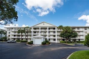 Wake up every morning to peaceful golf course views in one of the most beautifully updated condos in the prestigious Private Country Club Community of Pine Island Ridge.  This stunning 3rd-floor 2-bedroom, 2-bath residence offers an impressive 1,385 square feet of bright, open living space, completely transformed with high-end upgrades throughout.  The spacious layout is both functional and unique, featuring a full-size washer and dryer in-unit plus an additional room off the utility area large enough for a double bed—perfect for guests, a home office, or creative space.  What truly sets this property apart is the rare ability to buy and rent immediately, making it an exceptional opportunity for both homeowners and savvy investors.  Living in Pine Island Ridge means enjoying a resort-style lifestyle with country club membership included in your low maintenance. Residents enjoy access to a state-of-the-art gym, two restaurants, a resort-style pool, golf, tennis, and pickleball courts—all just moments from your door.  Located across from the community pool and BBQ area, and minutes to major highways for effortless commuting, shopping, dining, and entertainment. All within a highly rated school district.  Opportunities like this are rare. A fully renovated, spacious golf course condo with immediate rental ability in Pine Island Ridge is something buyers wait for.  Photos are beautiful, but the view and upgrades are even better in person—schedule your private showing