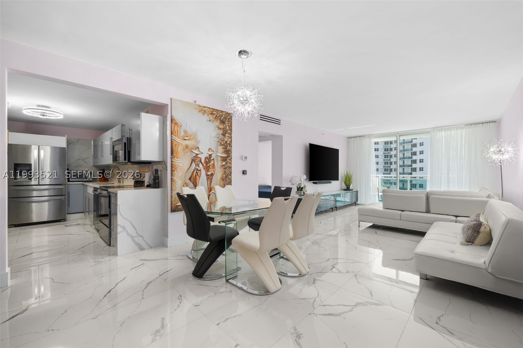 LIVE ACROOS THE BEACH! UNIQUE, HIGH-END, GORGEOUS DESIGN- TRULY ONE KIND*COMPLETELY RENOVATED 1 BED/1,5 BATH SPACIOUS 1,021 SQFT — THE MOST BEAUTIFUL UNIT IN THE BLDG***FULLY REMODELED WITH PERMITS & EXEPTIONAL TASTE* EVERYTHING IS BRAND NEW (2023): NEW A/C, NEW ELECTRICAL PANEL, NEW APPLIANCES, MODERN OPEN KITCHEN WITH SLEEK CABINETS* COFFEE MACHINE & WINE COOLER* FEATURES INCLUDE CUSTOM HIGH BAR TABLE WITH 3 BAR STOOLS, HUTCH WITH LIGHTING, DISPLAY CABINETS & EXTRA WALK-IN PANTRIES***NEW TILE FLOORING THROUGHOUT* BEAUTIFUL BALCONY WITH UPGRADED FLOORING AND FURNITURE* SPA-STYLE BATHROOM WITH SMART TOILETS AND LIGHTED MIRRORS.* INCLUDES "TRIDDAER AIR" PURIFICATION SYSTEM (2023, $1,500)* HIGH-QUALITY MODERN FURNITURE IS NEGOTIABLE, INCLUDING SONY 85” TV IN LIVING ROOM & SONY 65” TV IN BEDROOM* "ECOVACS ROBOTIC VACUUM & MAP"INCLUDED* HOA INCLUDES: WATER,CABLE TV, INTERNET,2-PARKING SPACES* CAN BE RENTED IMMEDIATELY — PERFECT FOR INVESTORS* ENJOY ACCESS TO SISTER BUILDING ON THE OCEAN SIDE WITH FULL RESORT-STYLE AMENITIES: 2 FITNESS CENTERS, 2 HEATED POOLS, MASSAGE ROOMS, STEAM ROOM, SPA, POOL-SIDE CABANAS, TIKI BAR, 24-HOUR SECURITY, CONCIERGE, VALET, CONVENIENCE STORE, BUSINESS CENTER AND MORE*WALK TO THE HOLLYWOOD BROADWALK, RESTAURANTS, AND SHOPS* PET FRIENDLY***NEXT TO BRAND NEW PUBLIX*RENOVATED BUILDING RESIDENCE ON HOLLYWOOD WITH PRIVATE BEACH ACCESS! SHORT DRIVE TO FORT LAUDERDALE AIRPORT*  DON'T MISS OUT!!!