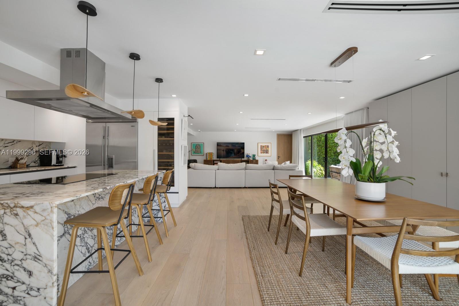 This residence captures a lifestyle that is private, lush, and effortlessly refined. Fully renovated and completely turnkey, the 4BR/4.5BA home showcases exposed wood beams, natural textures, and soft neutral finishes throughout, creating an elegant and cohesive living environment. Open-concept living and kitchen spaces flow seamlessly to the outdoors, offering an ideal setting for both everyday living and entertaining.
The resort-style backyard features a pool, summer kitchen, fire pit, and mature tropical landscaping for ultimate privacy. Interiors are thoughtfully curated with a warm, sophisticated aesthetic, with furnishings negotiable for a seamless move-in experience.
Situated in the highly sought-after Bay Heights neighborhood, this is a rare opportunity to own an elegantly renovated, move-in ready home.