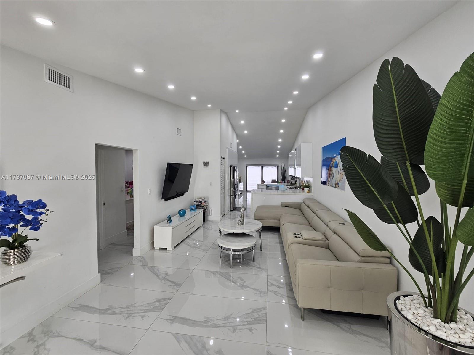 Fully renovated and beautifully designed, this stunning single-family home in Hialeah’s sought-after Alameda by the Lake offers modern living at its finest! Featuring an open-concept layout, this 3-bedroom, 2-bathroom home includes a versatile den, easily convertible into an in-law quarters. The state-of-the-art kitchen boasts sleek quartz countertops, premium stainless steel appliances, and ample storage. Enjoy breathtaking lake views from the covered patio, perfect for relaxing or entertaining. With a brand-new roof, AC, water heater, impact doors and windows, plus a new washer & dryer, brand new electrical and plumbing. Conveniently located near top-rated schools and major highways, including I-75, Palmetto, and Okeechobee. A true must-see! Room for a Studio and extra income.