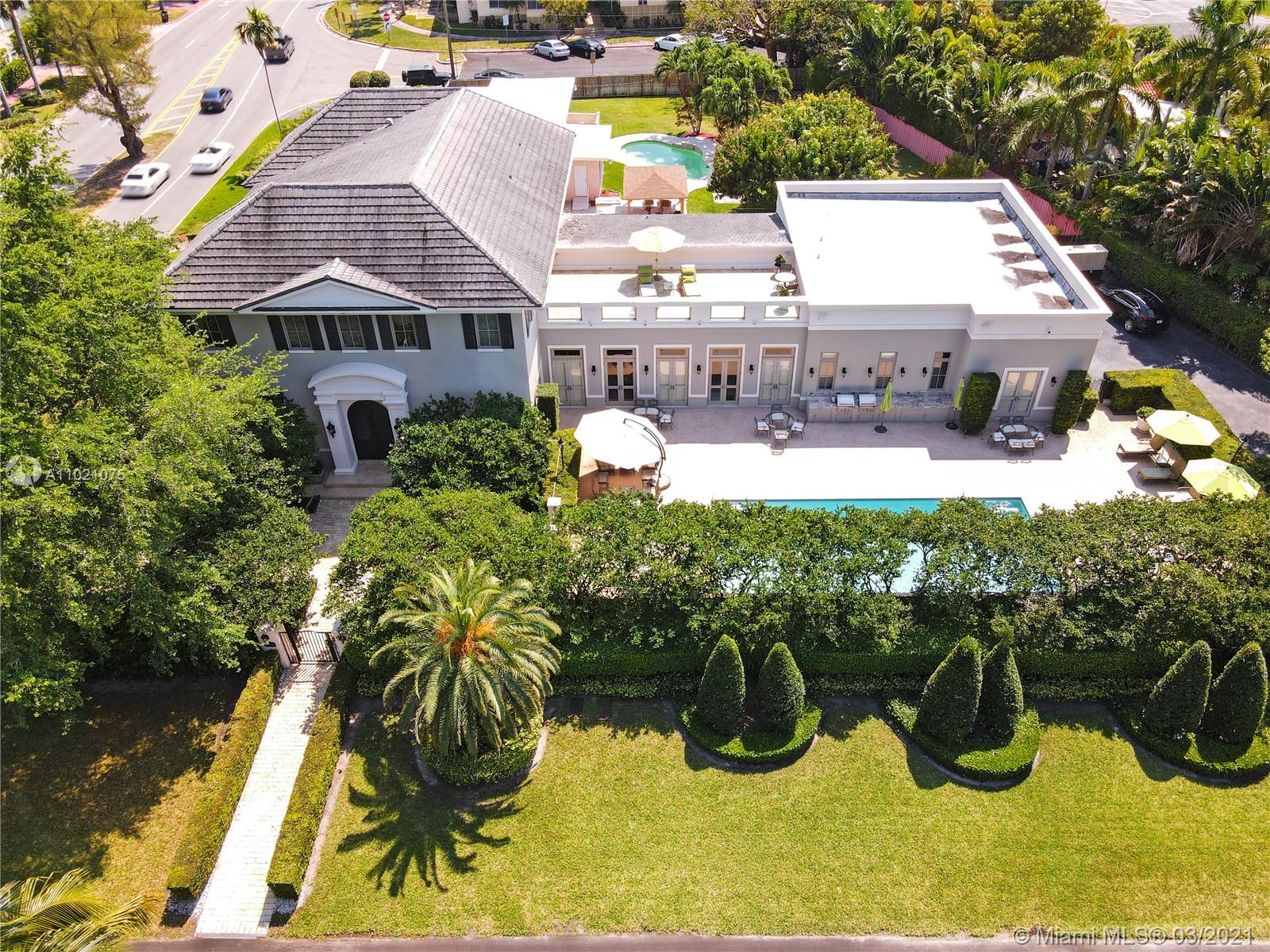 7 Bedroom 5.5 Bath elegant French neoclassical masterpiece by noted architect Jorge Hernandez. Enter through your beautiful intimate French garden on quiet 31st Street. Tall doors with transoms, 12 in. baseboards, fabulous crown moldings and features throughout. Impact windows and doors & full home generator plus elevator. Open 12 1/2 ft ceilings on main level. State-of-art kitchen within spacious family/ great room and extra-large living areas. Main suite with grand oversized walk-in closet. Private rooftop deck perfect for entertaining. Heated oversized 40x18' pool, 2 outdoor barbeques & grill. House is elevated 3 ft above ground level. Lighting fixtures are not included. Truly one-of-a kind! A must see!