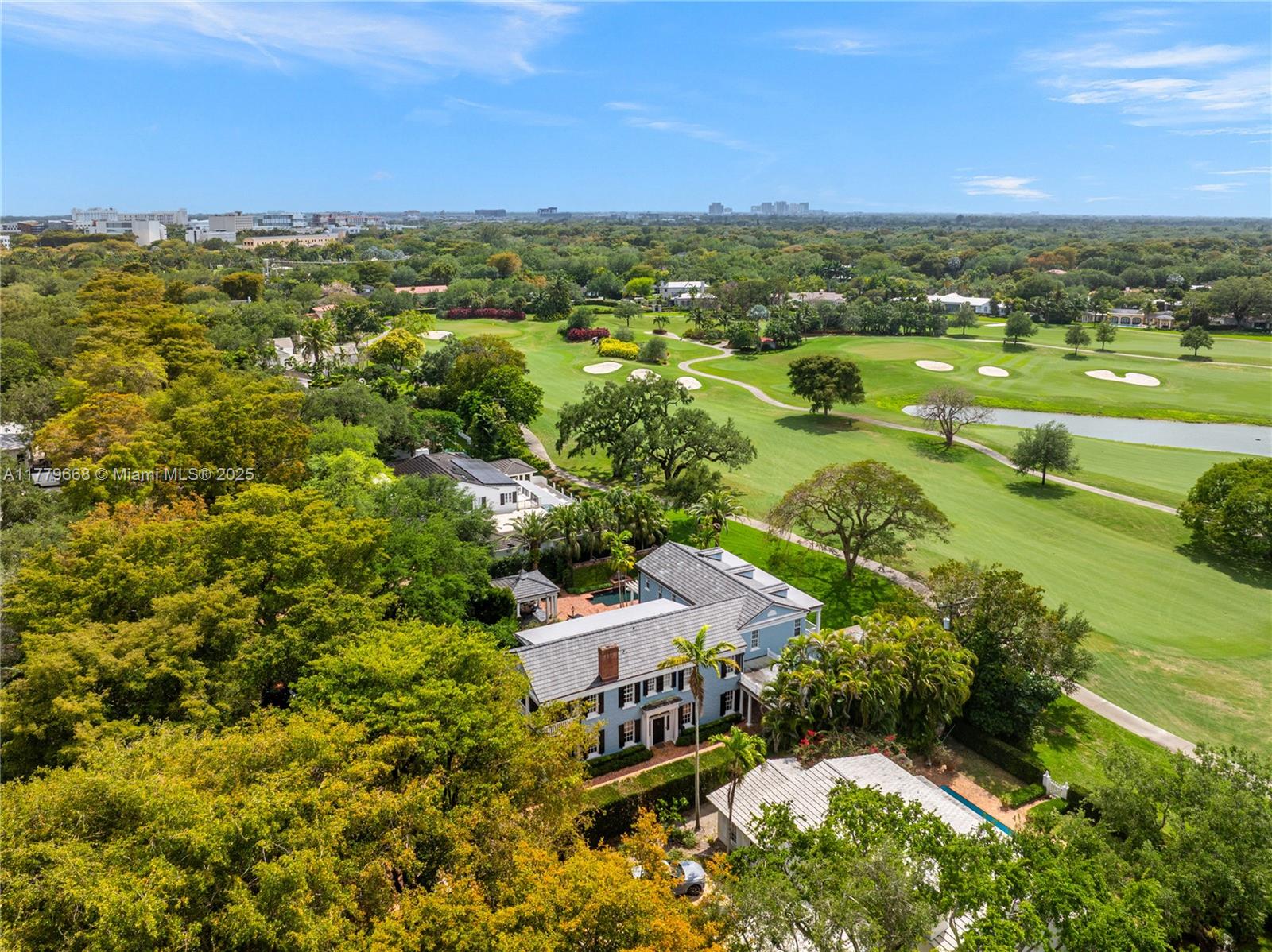 Overlooking the 15th Hole of the Riviera Golf Course, this original 1926 Pioneer Village Home has been renovated to perfection, blending classic Gables details with thoughtful, modern spaces.  Spanning 6,153 square feet on a 16,875 square foot lot, the home includes 5 bedrooms and 4.2 baths.  There are elegant entertaining areas inside and out, including the grand formal living and dining rooms, stunning kitchen with large center island and butler’s pantry, French doors open to lovely covered patios, pool, and new summer kitchen with glorious views. The second floor primary suite has a chic, updated bathroom, dressing room, and spacious walk-in closet. With dreamy vistas, fabulous living spaces, and a separate guest house, this is Coral Gables classic.