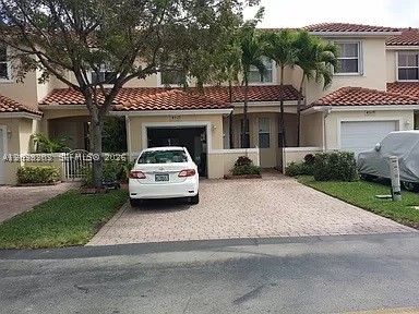 LOCATION LOCATION LOCATION!! Premium location in Doral, a Doral Chase Townhouse of 4 bedrooms, 2 full baths and a half bath. Laminated wood floors. Great fenced backyard with plenty of space for a delicious Bbq. Walking distance to essentials such as Publix, Walgreens, restaurants, etc. Access to Doral Park Clubhouse with community pool, tennis courts, children playground and much more. Easy access to major highways