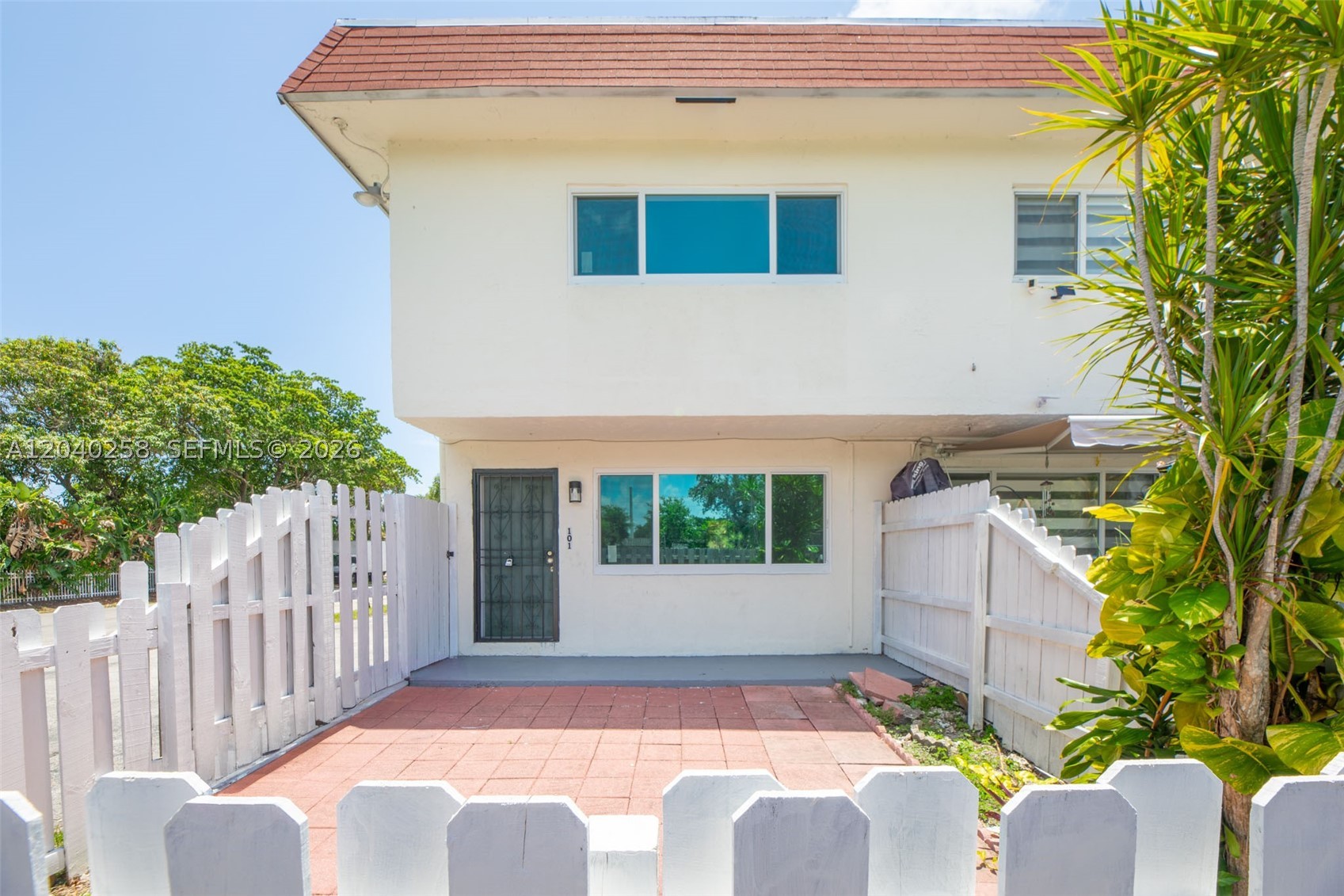 Beautiful 2-story townhouse for sale at 1450 NE 151st St #101, Miami, FL. This move-in ready home features 2 spacious bedrooms and 1 full bathroom upstairs, plus a convenient half bathroom on the first floor. Enjoy a bright and functional layout with plenty of natural light, impact windows throughout, and a private front patio along with a fenced backyard—perfect for relaxing, entertaining, or creating your own outdoor retreat.

Additional features include washer and dryer hookups, 1 assigned parking space, and a desirable location close to shopping, dining, schools, and major highways. Whether you're a first-time homebuyer, investor, or looking to downsize, this charming townhouse offers comfort, convenience, and great value.

Don't miss this opportunity to make this beautiful property your new home!