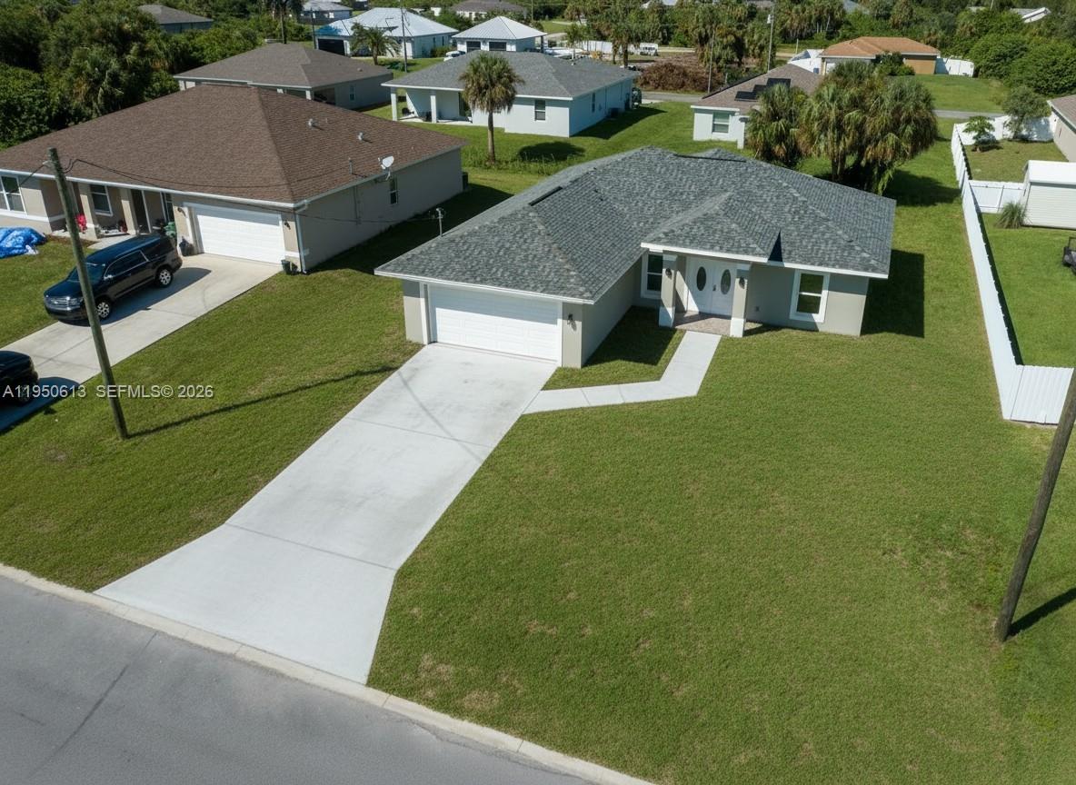 Beautiful new CBS construction home located in a fast-growing neighborhood of newer homes! This quality-built residence features elegant porcelain tile throughout, impact-resistant windows and doors (including the garage door), and a covered, tiled lanai and entryway. Inside, enjoy an open layout with cathedral ceilings, recessed lighting, and granite countertops. The spacious laundry room offers an additional pantry for extra storage. Best of all, this property is not in a flood zone, has no HOA, and qualifies for 100% USDA financing.