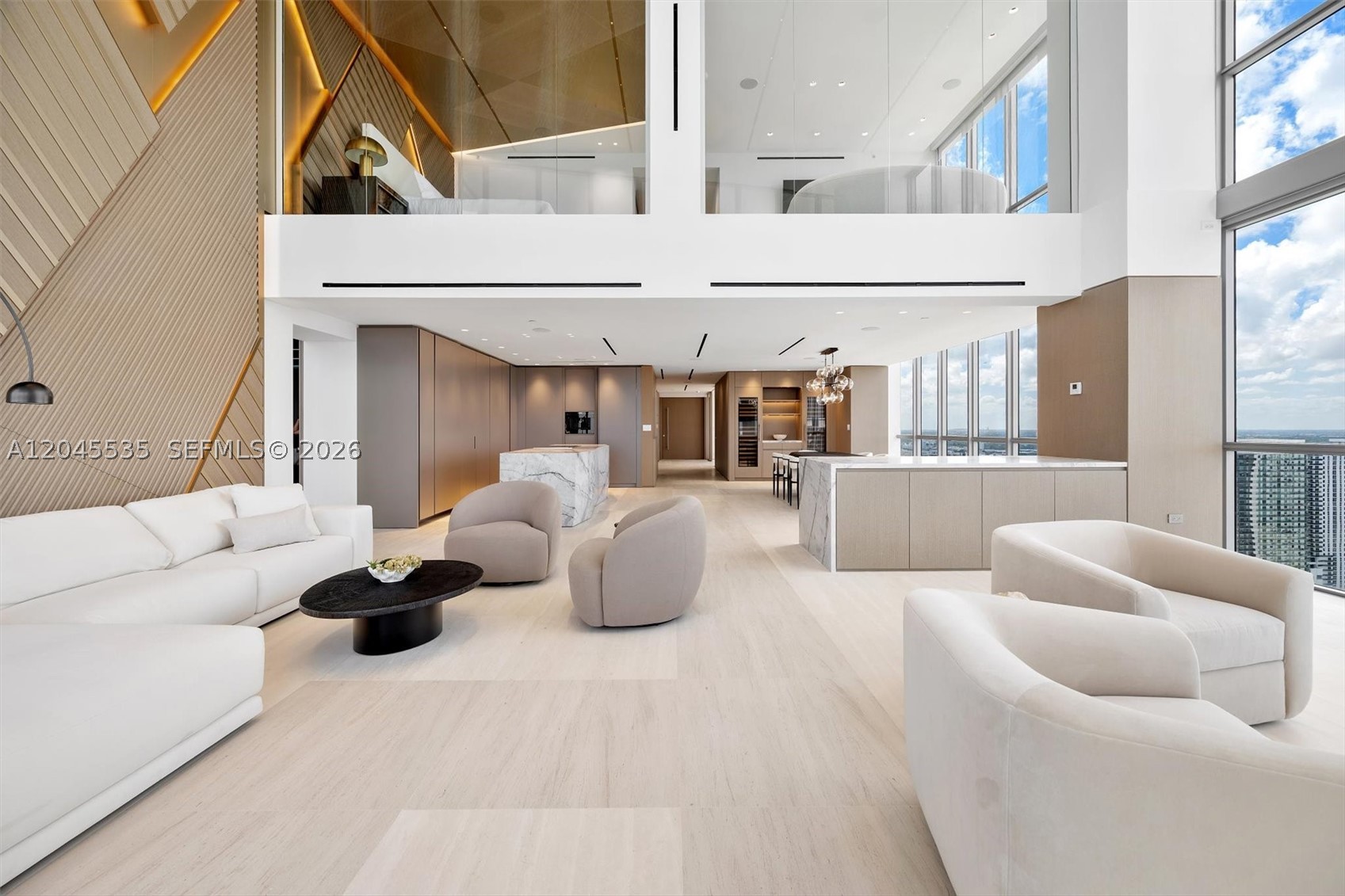 Experience an extraordinary one of a kind level of luxury in this brand-new, never-lived-in residence at the iconic Marquis Miami. Encompassing approximately 5,400 square feet, this exceptional 4-bedroom, 4-bathroom home was masterfully designed by renowned architect Kobi Karp, blending timeless elegance with contemporary sophistication. Expansive floor-to-ceiling glass showcases breathtaking panoramic views of Biscayne Bay, the Atlantic Ocean, PortMiami, and the glittering Miami skyline, while generous terraces create the perfect setting for seamless indoor-outdoor living. The thoughtfully designed floor plan offers grand entertaining spaces, a gourmet chef's kitchen, luxurious bedroom suites, spa-inspired bathrooms, and exquisite designer finishes throughout. Located in the heart of Miami's Arts & Entertainment District, Marquis places you directly across from the Kaseya Center, home of the Miami Heat, and the Adrienne Arsht Center for the Performing Arts. You're also moments from the Frost Museum of Science, Pérez Art Museum Miami (PAMM), Museum Park, PortMiami, Miami Beach, the Miami Design District, Wynwood, Brickell, and Downtown Miami's world-class dining, shopping, nightlife, and cultural attractions. Residents enjoy five-star amenities including 24-hour concierge and valet, resort-style pool, state-of-the-art fitness center, and spa. This is a rare opportunity to own one of Miami's most prestigious luxury residences. Come and create an unparalleled lifestyle!