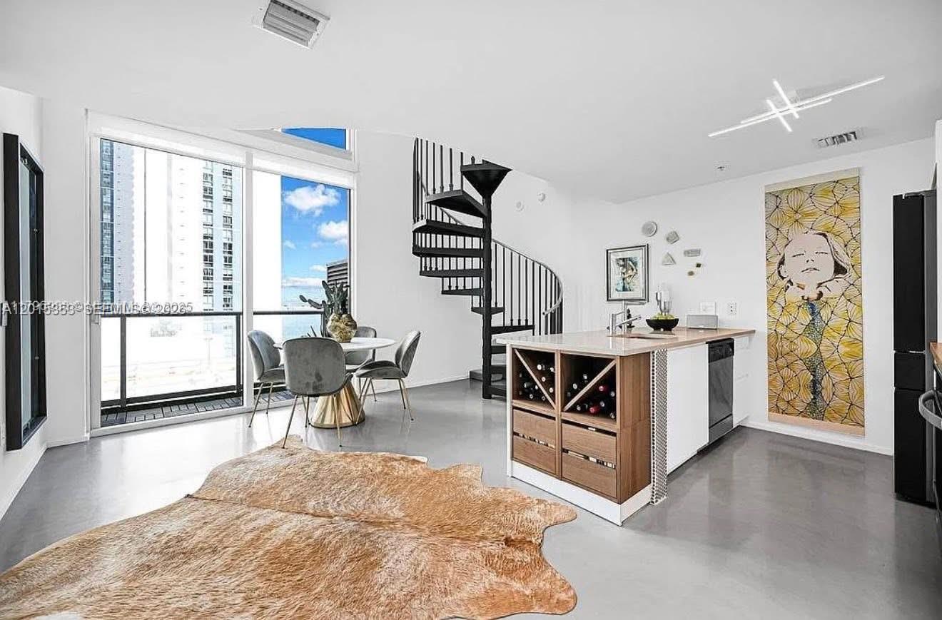 Beautifully remodeled WATERFRONT LOFT with 19 ft ceilings, this unit is a RARE find! Dont miss your opportunity to LIVE at this beautiful place or rent it for an investment!! MUST SEE IN PERSON! Building value is only going up with a brand new gym and pool! Tenant occupied until September 2026 at $4300 a month. EASY TO SHOW!