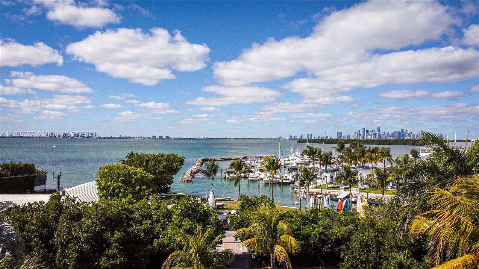Located on exclusive & prestigious Harbor Dr. 1 of only 8 properties located directly facing Key Biscayne Yacht Club. 
Enjoy some partial ocean views from the balcony, living and dining area. Fully renovated: floors, baths, kitchen, brand new high impact doors & windows. 10 ft elevated. 
UL: High ceilings, spacious and ideal Living & Dining Area with spectacular views to KBYC. 1/2 bath. Master bedroom with walk in closet, bathroom with double sinks, shower & bathtub. Luminous kitchen with lots of storage space & dine in area. 5th Bed/Office.
LL: 3 spacious & bright bedrooms. 3 renovated full bathrooms. Laundry room with direct access. Family room with access to the pool & barbeque area. 
Exterior: Covered terrace. With barbeque. Integrated pool & barbeque area on the same level.
