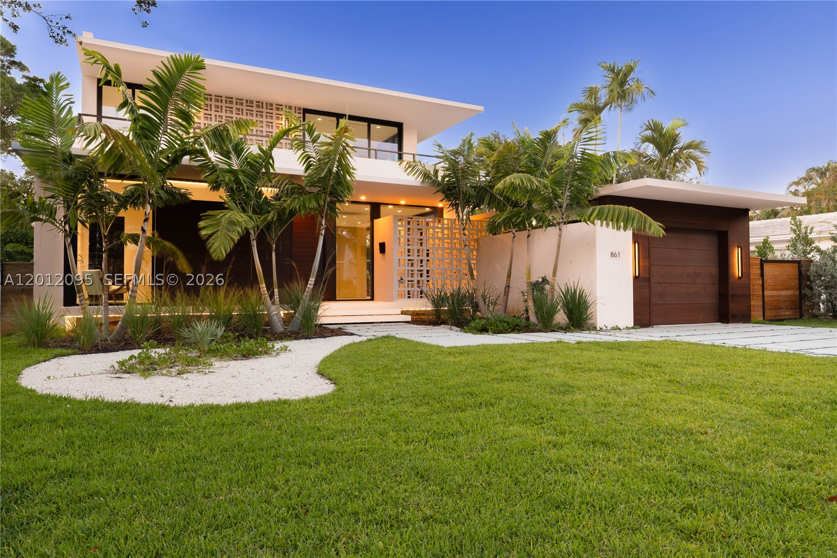 Experience the perfect blend of timeless design and modern luxury in this stunning tropical mid-century residence. This exceptional 5-bedroom, 5.5-bath home showcases top-of-the-line finishes throughout, complemented by exquisite custom woodwork in both the kitchen and closets, adding warmth and sophistication to every space.

Designed for both comfort and entertaining, the home features a seamless indoor-outdoor flow that opens to a spectacular pool area. The beautifully crafted summer kitchen creates the ideal setting for gatherings, whether hosting intimate dinners or lively celebrations.

Surrounded by lush tropical landscaping, this property offers a private oasis where style meets functionality. A rare opportunity to own a truly distinctive home that captures attention from the moment you arrive. Detached cabana with full bath, ideal as a gym, guest suite or home office .