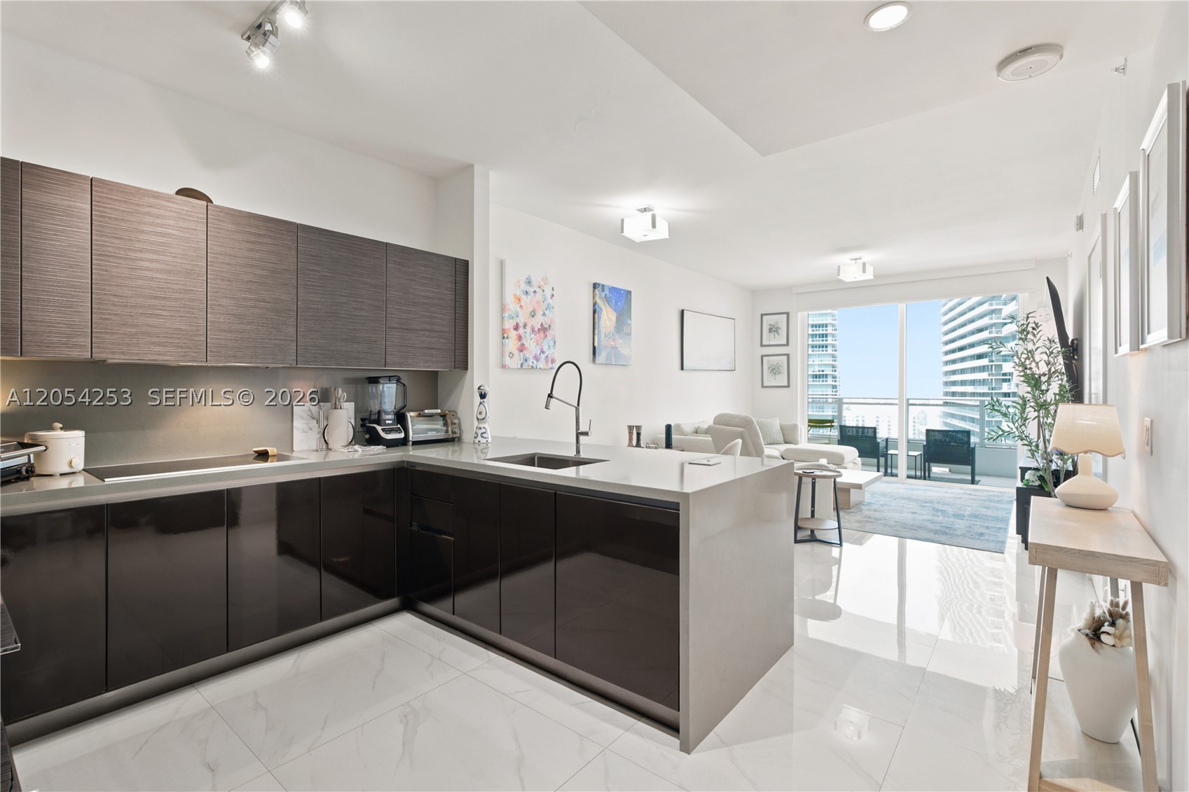 Spectacular 1-bed / 1 b ath unit plus den. Enjoy the luxury lifestyle and fantastic Miami Skyline views. Floor to ceiling impact glass windows, spacious walk in closet, Bosch appliances, spacious balcony, and European-style cabinetry with Silestone countertops. Residents of The Bond on Brickell enjoy a number of upscale amenities, including a sundeck with lush landscaping and a waterfall, a zero-edge lap pool, poolside cabanas, an outdoor fireplace, and a barbecue area, fitness center, business center, a children's playroom, clubroom, and The Parliament Lounge with a screening room. The Bond on Brickell offers valet parking and concierge services.