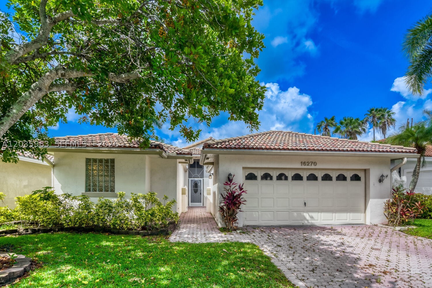 Spectacular single-story pool home located in the premier, highly sought-after community of Weston! This beautiful 3-bedroom, 2-bathroom residence offers an exceptional open-concept layout accented by stylish, low-maintenance tile flooring throughout. The gourmet kitchen serves as a true center point for entertaining, with recessed lighting, and custom cabinetry. Retreat to the spacious bedrooms or enjoy seamless indoor-outdoor living. Step outside to your private, fully fenced backyard oasis, featuring a sparkling swimming pool and an attractive patio space perfect for lounging or dining under the stars. Unbeatable location tucked away in a quiet neighborhood, yet just minutes away from top-rated corporate parks, fine dining, premium shopping, and Weston's A-rated schools. Move-in ready and a must-see!