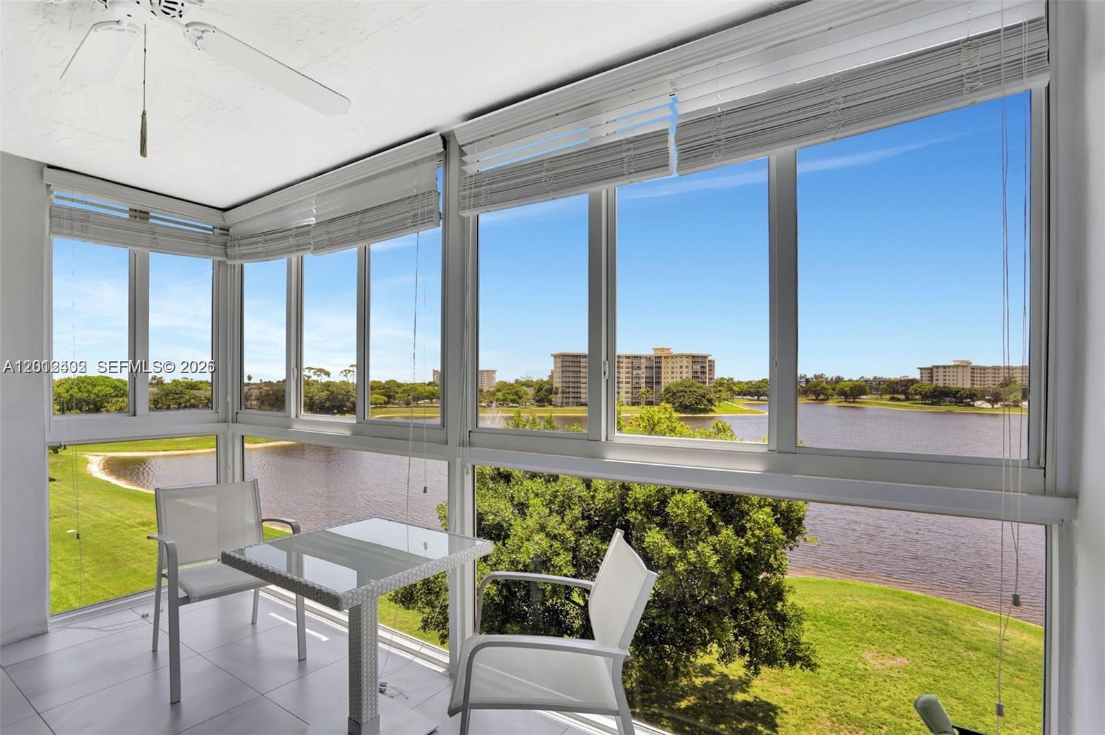 Welcome to this beautifully maintained 2-bedroom, 2-bath condo located in the highly sought-after Palm Aire community, perfectly situated along a scenic golf course. This bright and spacious residence features hurricane-impact windows throughout, offering superior protection, energy efficiency, and added peace of mind year-round. Both bedrooms are comfortably sized, with walk in closets and natural light. Step out onto the private balcony to enjoy panoramic water views and lush fairways, an ideal setting for your morning coffee or unwinding in the evening. Residents of Palm Aire enjoy access to a host of amenities including golf, swimming pools, walking trails. MUST SEE!!