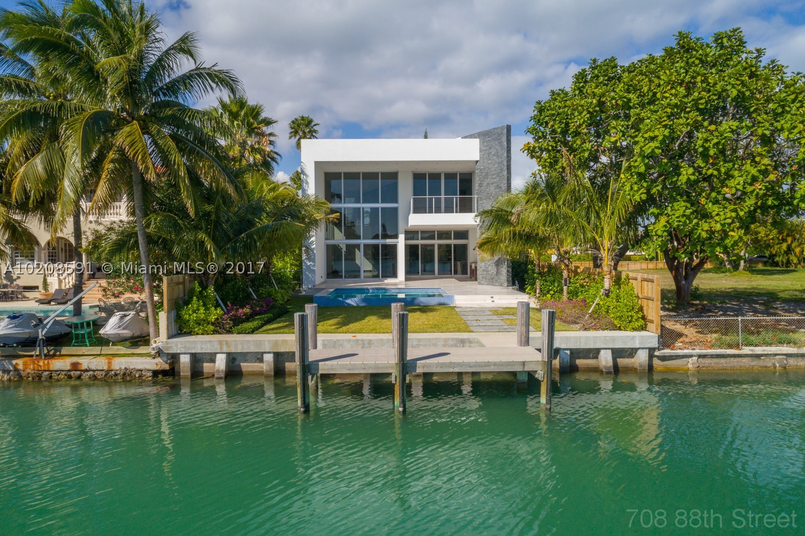 Amazing opportunity to own a brand new never lived in waterfront home in Miami Beach. At $800/sf this is the best deal for a new home in Miami Beach. Featuring a 6,144 sf interior w/ Vena Grigio Italian Marble, Italian kitchen w/ sub-zero & wolf appliances, TV Room, office, formal great room, dining room, maids quarters. 2nd floor boasts wood floors, grand master suite, 3 bedrooms & family room. Outdoor space w/ amazing views, wolf kitchen, pool, boat dock, new seawall. Nothing but the best finishes!