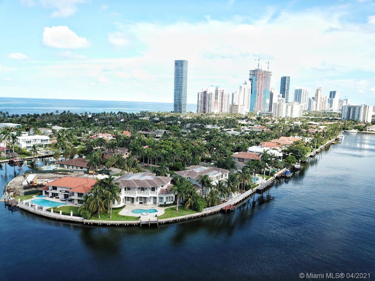 Exceptional Mansion on 150 feet of the Intracoastal Waterway. State of the art home with seven bedrooms, seven and 1/2 bathrooms, a theatre, elevator, gourmet Kitchen, impact doors and windows, and many upgrades. Gated for privacy. * Chandeliers, windows curtains, and blackouts are not included in the sale*