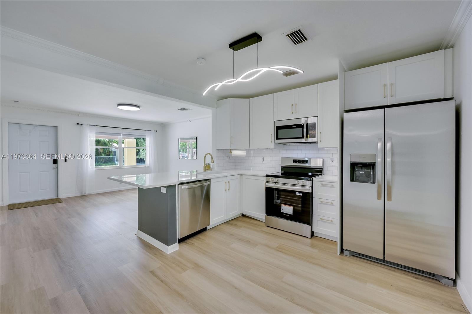 Experience life in Fort Lauderdale in this beautifully updated home