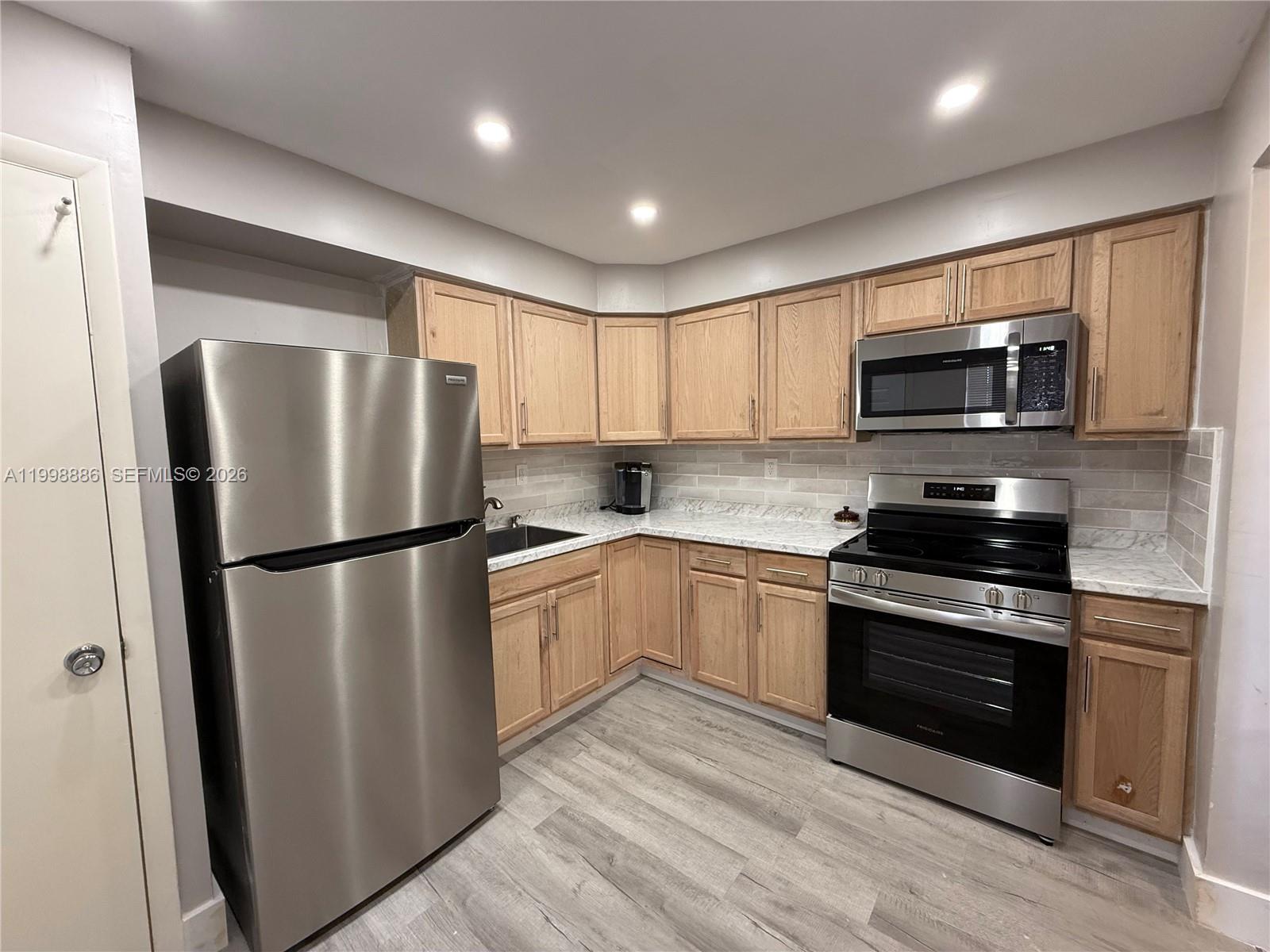 Light, bright, and beautifully updated, this 1 bedroom, 1.5 bath condo offers easy first-floor living. With fresh neutral paint, remodeled kitchen, updated bathrooms, and stylish luxury vinyl plank flooring that flows throughout. The spacious bedroom includes an en-suite bath, plus there’s an extra half bath for added convenience. Outside your door, enjoy serene walking paths with scenic water views—perfect for a morning stroll or unwinding at the end of the day. The community also offers a sparkling pool, gym, auditorium, and meeting rooms to enjoy. Ideally situated just minutes from the beach, shopping, grocery stores, restaurants, entertainment, and even the Hardrock stadium. With first-floor access and move-in ready updates, this is an ideal place to call home. ** No Rentals **