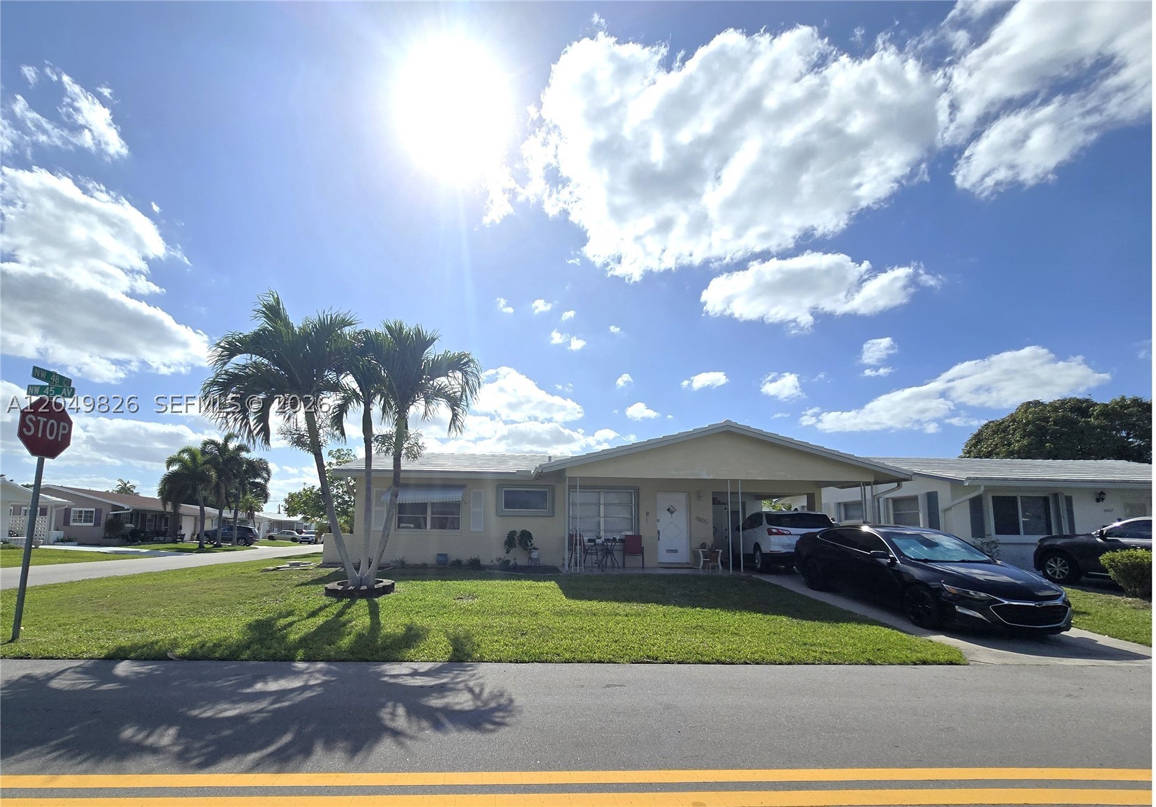 Welcome to this charming and beautifully maintained 1-story, 2-bedroom, 2-full-bath home, perfectly situated on a desirable corner lot in a peaceful 55+ community in Tamarac. Enjoy the convenience of the covered carport, keeping your vehicle protected from the Florida sun and providing a dry welcome home on rainy days.

Step inside to discover a bright and inviting interior filled with natural light, smooth ceilings with no popcorn texture, modern lighting, and a functional floor plan designed for comfortable everyday living. The well-appointed kitchen is ideal for preparing your favorite meals, while the two beautifully remodeled bathrooms add a fresh, contemporary touch. An updated electrical panel provides added peace of mind.

Outside, the spacious corner yard offers plenty of room to relax, garden, or spend time with your furry companion—dogs are welcome! The attached covered carport also provides additional storage space.

Embrace the active and carefree lifestyle this friendly 55+ community has to offer. The community clubhouse and refreshing swimming pool are just two blocks away, making it easy to enjoy social activities, meet neighbors, or simply unwind in the Florida sunshine. With a low HOA fee of only $100 per month, this quiet neighborhood offers exceptional value and a wonderful place to call home.

Don't miss this opportunity to enjoy comfort, convenience, and the relaxed Florida lifestyle you've been looking for!