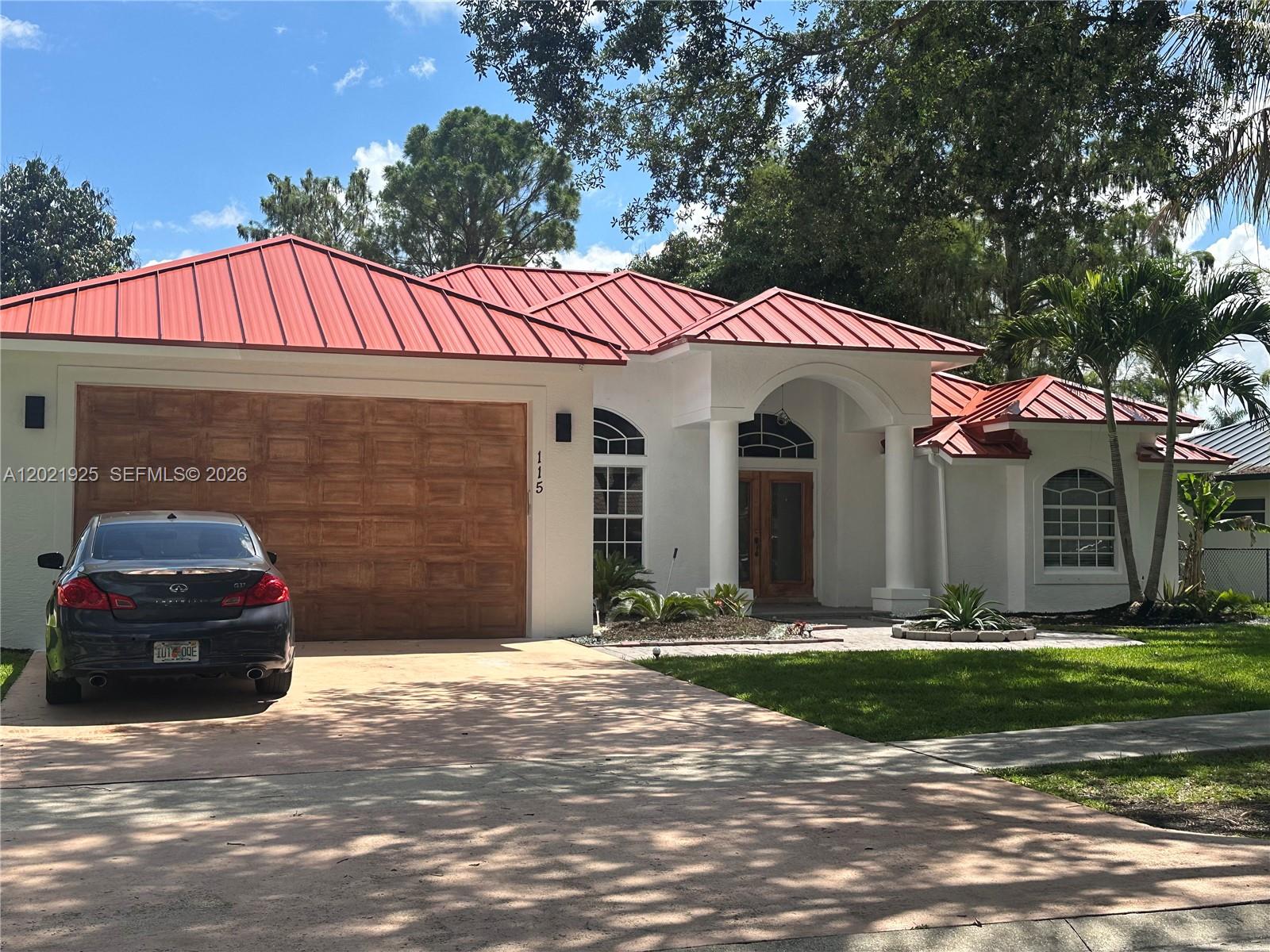 Welcome to this beautifully updated home in a gated community – Royal Palm Beach, FL 33411. Offering 1,708 sq. ft. under air and a total of 2,462 sq. ft., this home features 3 bedrooms plus a den, 2 full bathrooms, and a 2-car garage. Enjoy the real electric fireplace, a finished screened porch, and a lovely open porch perfect for entertaining. Plus, there’s a beautiful gazebo and a fire pit ideal for a family campfire. Outside, mature fruit trees—including mango, banana, and coffee—create a lush, tropical escape. A brand-new metal roof completes the package.