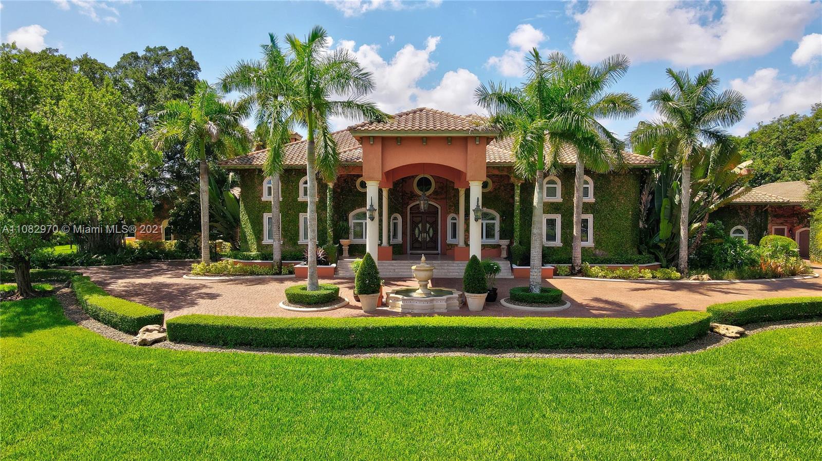 Drive through the gate and up the tree lined paver driveway of this stunning 4.7 acre estate and let us welcome you home! Be awed by its casual elegance, unique design and attention to detail. Mature trees and meticulous foliage create an unparalleled private backdrop for making memories with family and friends. Main house features 4 bedrooms, 4 full baths and 2 half baths, huge loft (could be bedroom), 2 offices, library, wine cellar, 2 fireplaces and amazing 1500+ sq ft kitchen/great room. Guest house consists of living area, kitchen, 1 bedroom, large flex room and 2 bathrooms. Step on to the wraparound porch which opens to pool, spa and complete summer kitchen to take in the surrounding beauty. Impact windows/doors, 8+ car garage, home generator and much more. Nothing Compares!