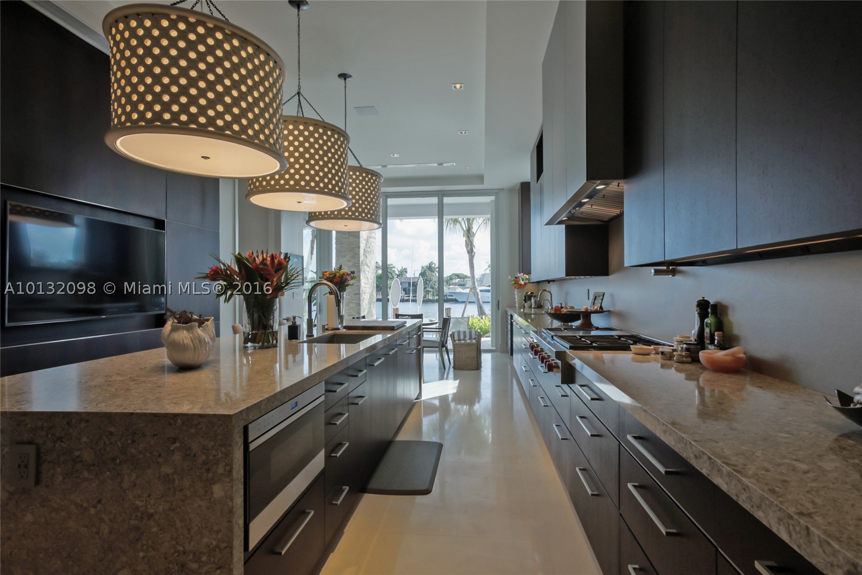 Unique, stunning, modern gated estate.Partially furnished. Turn-key.Built 2016.90ft water frontage with panoramic views and dock for up to 70ft boat. Infinity pool with attached spa.Designer chefs kitchen with walk-in cooler.Sub-Zero/Wolf appliances with wine storage. Five VIP suites with wet bar and balconies.Master his/hers bathrooms with spacious walk-in closets.Elevator.Separate office.Two attached garages with lifts (house up to 5 cars).Water filtration system throughout.Security cameras throughout.